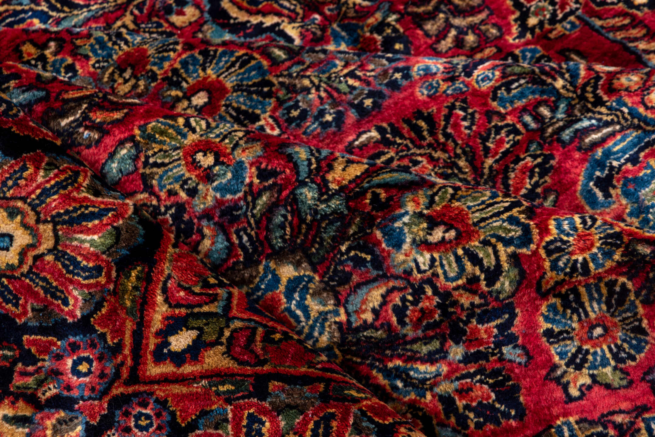 10' x 22' one-of-a-kind handmade vintage Sarouk rug. Color palette: black, blue, brown, burgundy, gray, pink, red