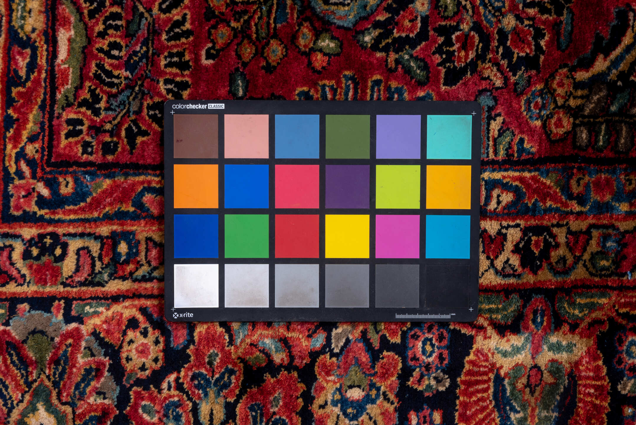 10' x 22' one-of-a-kind handmade vintage Sarouk rug. Color palette: black, blue, brown, burgundy, gray, pink, red