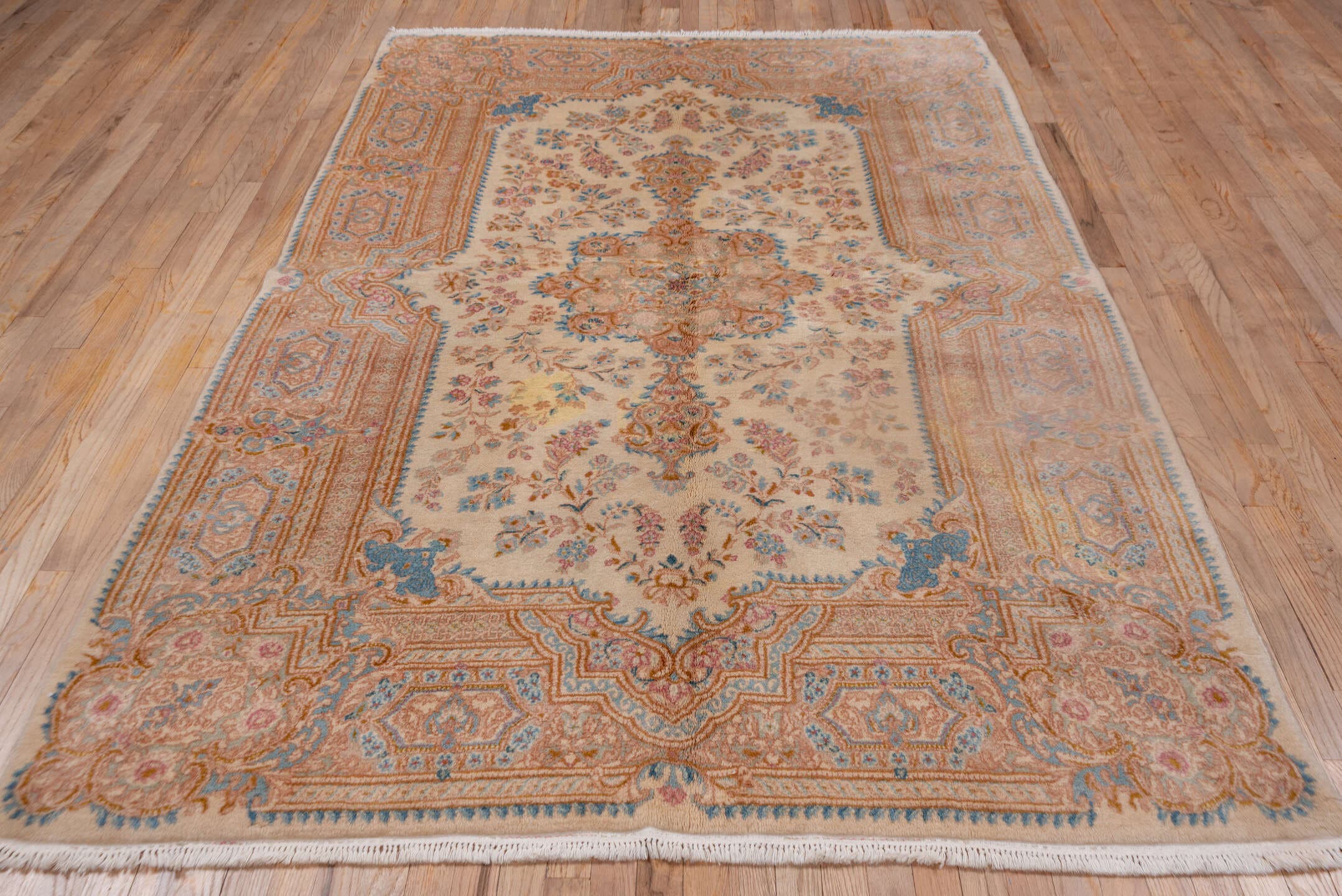 5' x 9' one-of-a-kind handmade vintage Kerman medium size rug. Color palette: ivory, beige, sky blue, blush, gold, taupe