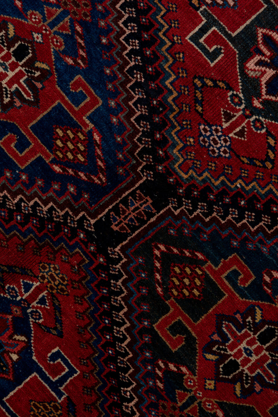 4' x 9' one-of-a-kind handmade antique Baktiary runner rug. Color palette: crimson, navy, ivory, camel, sky blue, rose