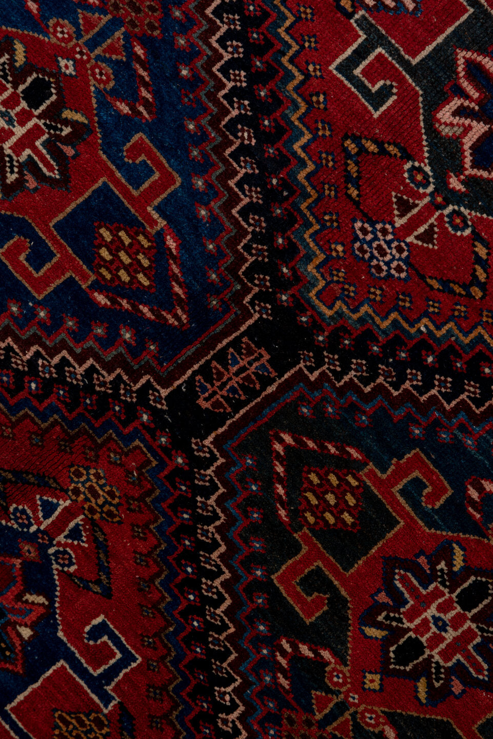 4' x 9' one-of-a-kind handmade vintage Baktiary runner rug. Color palette: black, blue, brown, fiord, gray, pink, red