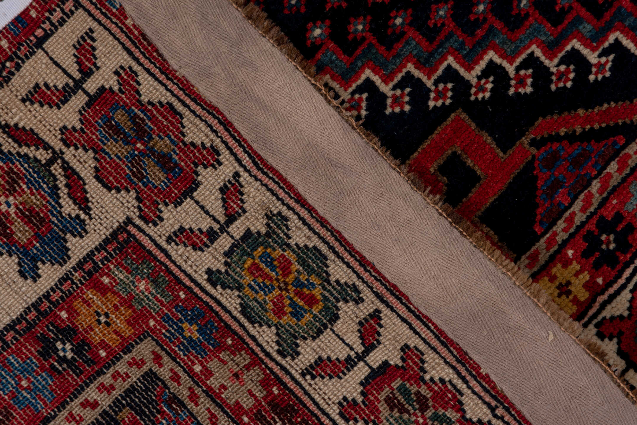 4' x 9' one-of-a-kind handmade vintage Baktiary runner rug. Color palette: black, blue, brown, fiord, gray, pink, red