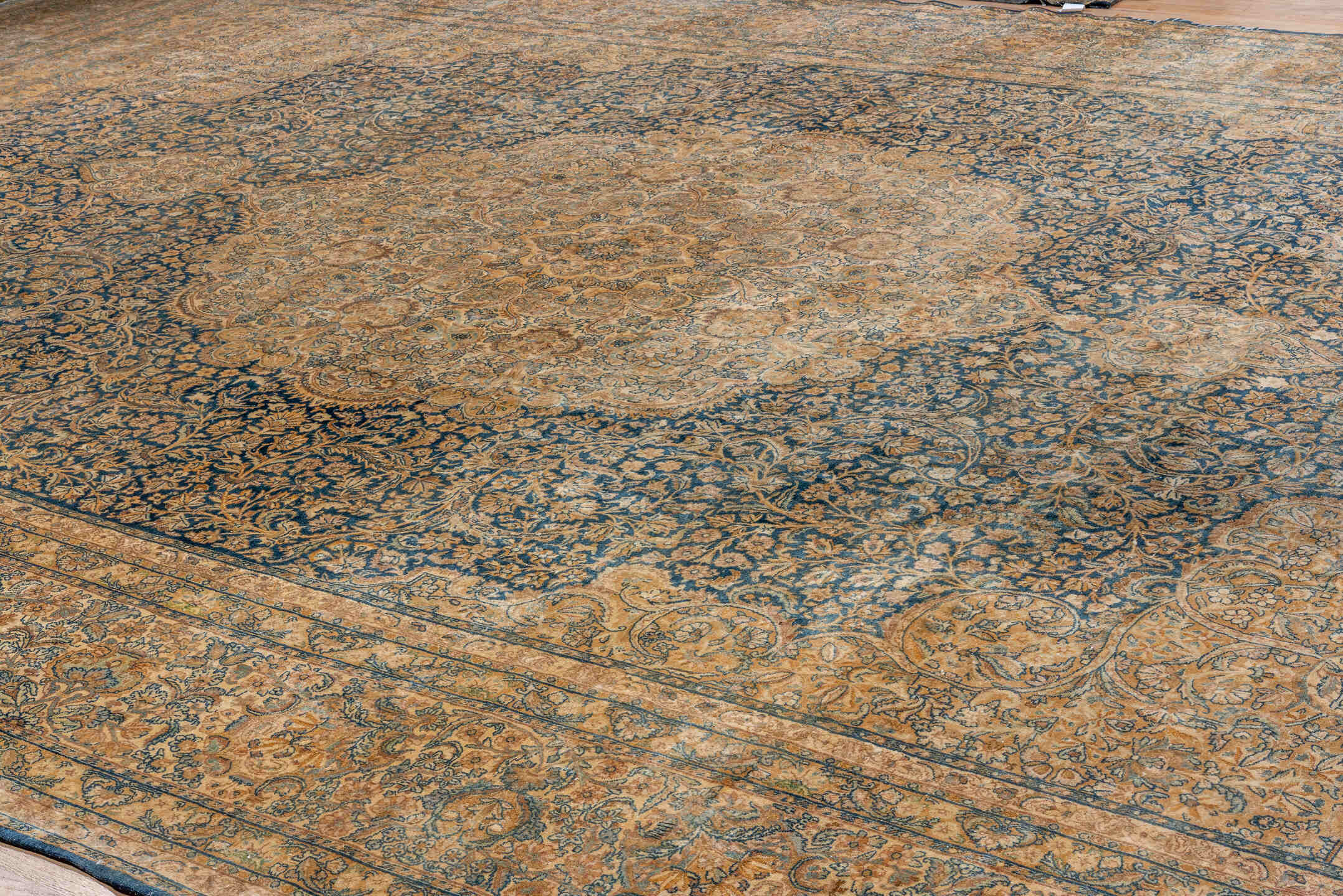 13' x 21' one-of-a-kind handmade antique Kerman oversize rug. Color palette: camel, navy, ivory, taupe, slate, beige, blue