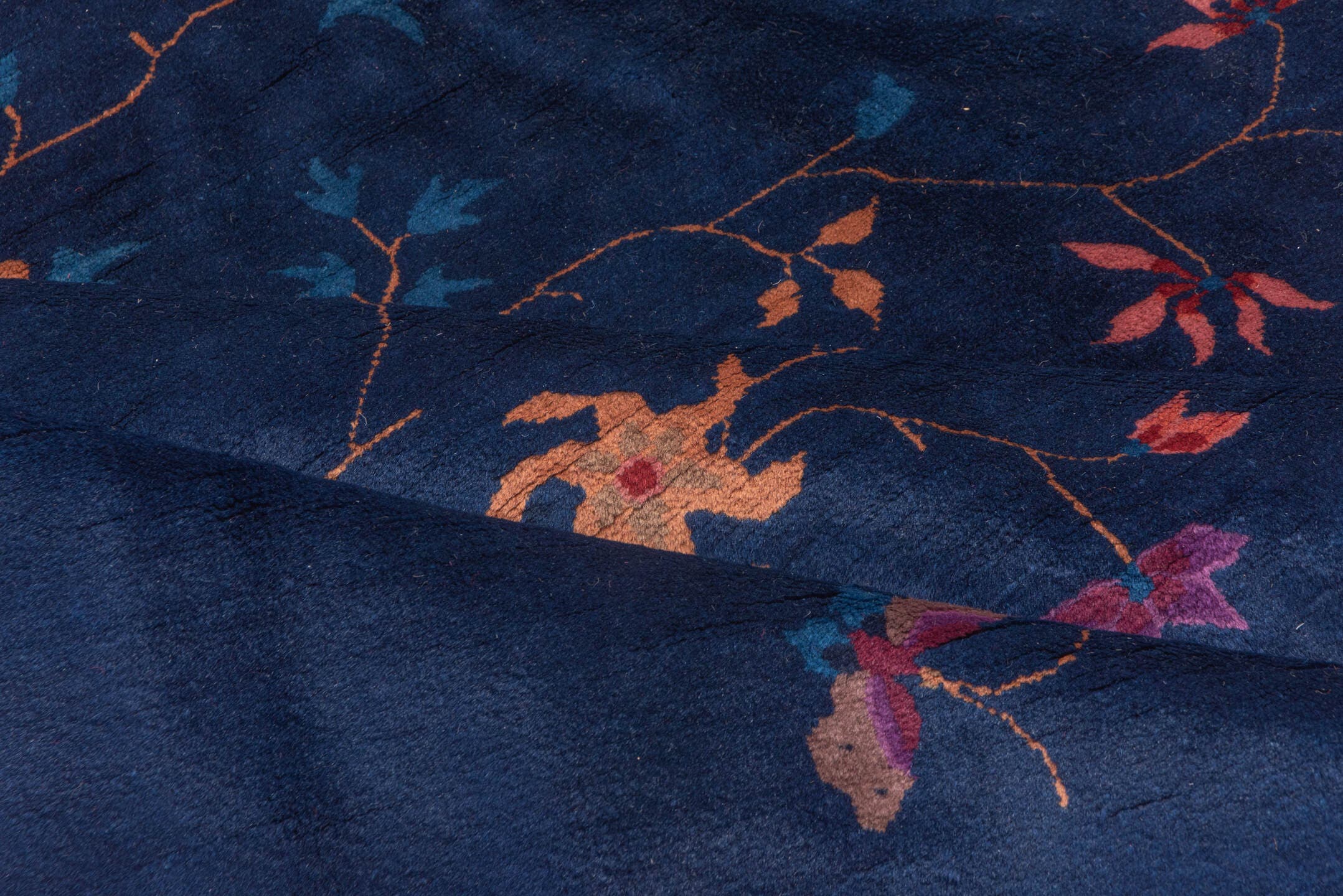 8' x 9' one-of-a-kind handmade antique Chinese rug. Color palette: navy, plum, sky_blue, peach, rose, indigo, ivory, blue