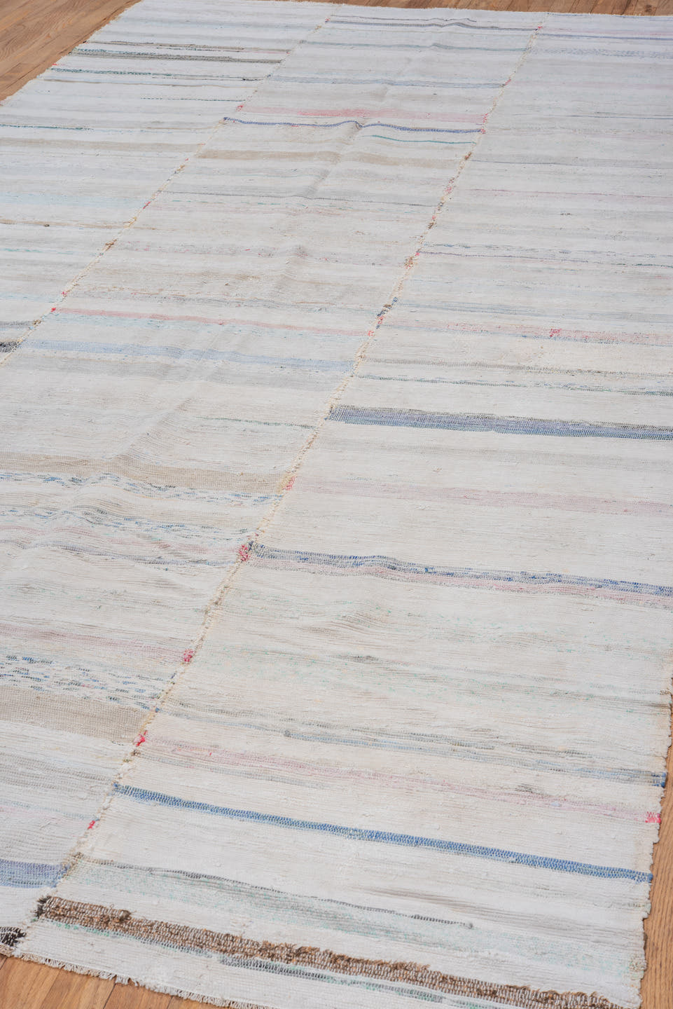 5' x 11' one-of-a-kind handmade antique Rag Rug rug. Color palette: ivory, pale blue, blush, taupe, charcoal, aqua