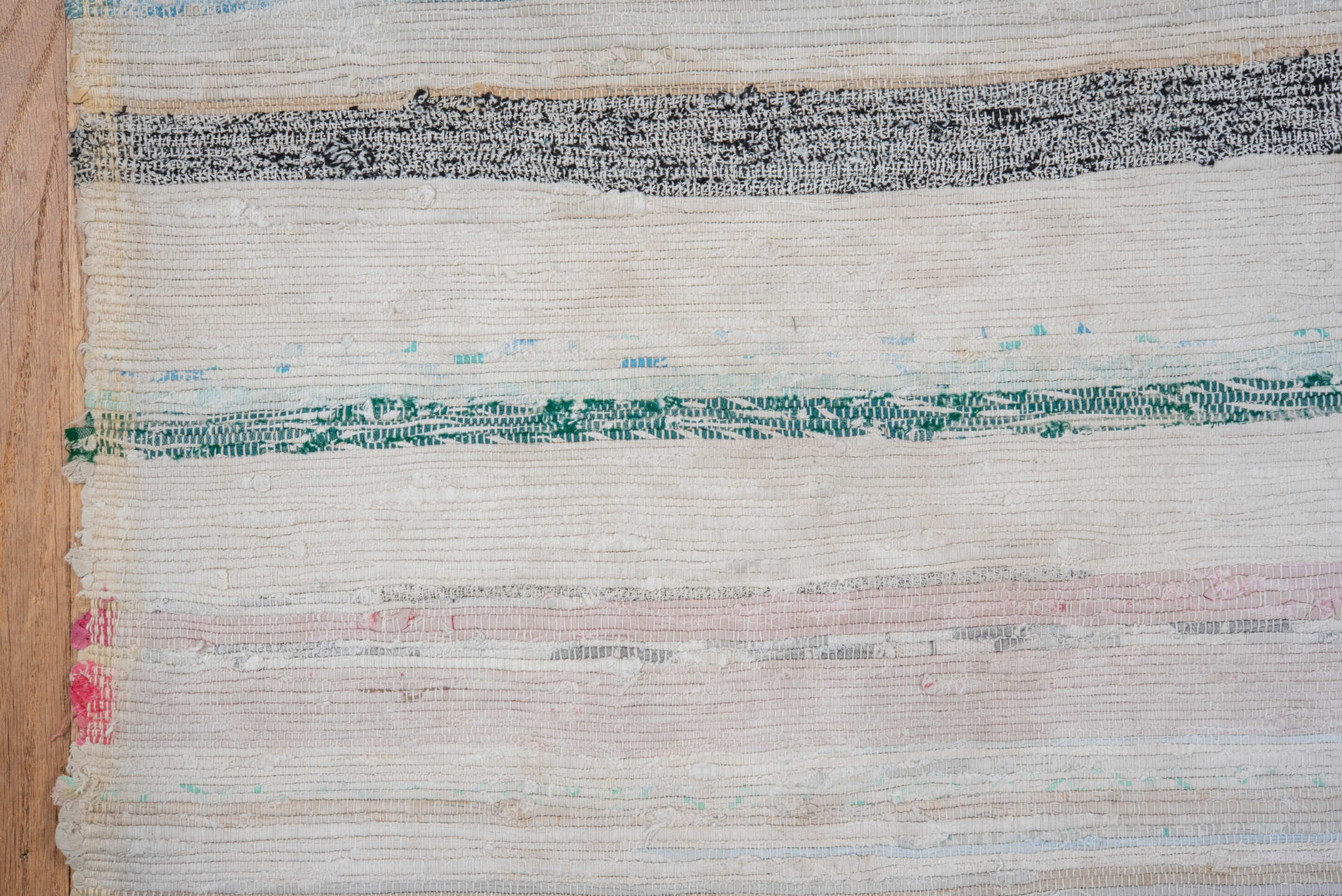 5' x 11' one-of-a-kind handmade antique Rag Rug rug. Color palette: ivory, pale blue, blush, taupe, charcoal, aqua