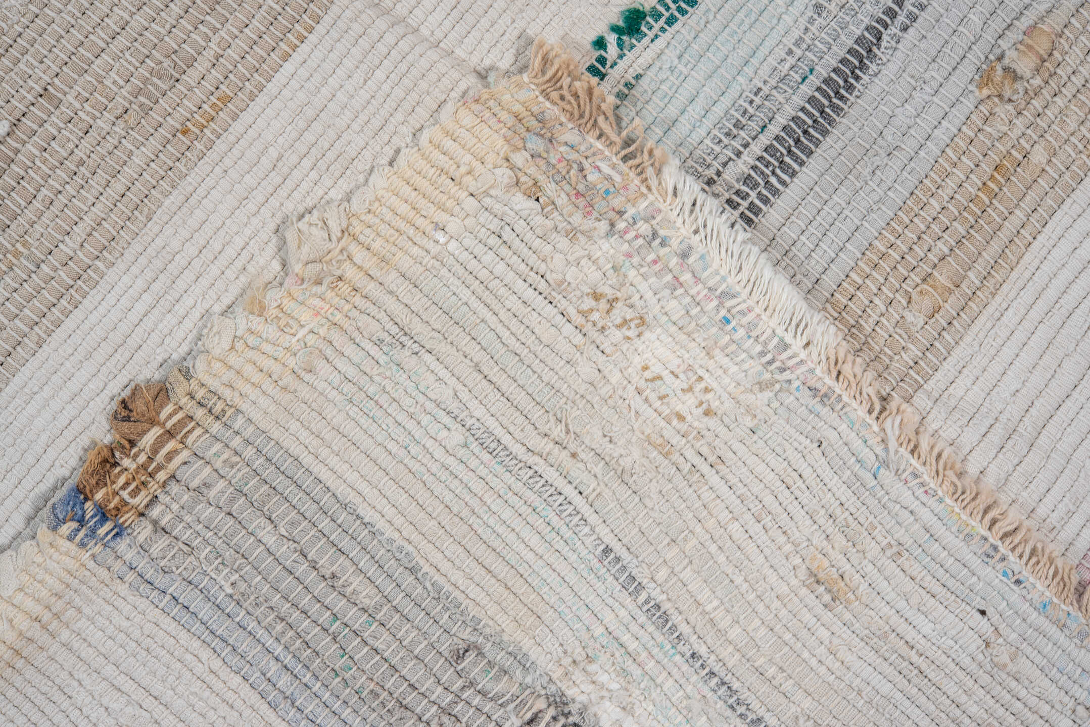 5' x 11' one-of-a-kind handmade antique Rag Rug rug. Color palette: ivory, pale blue, blush, taupe, charcoal, aqua