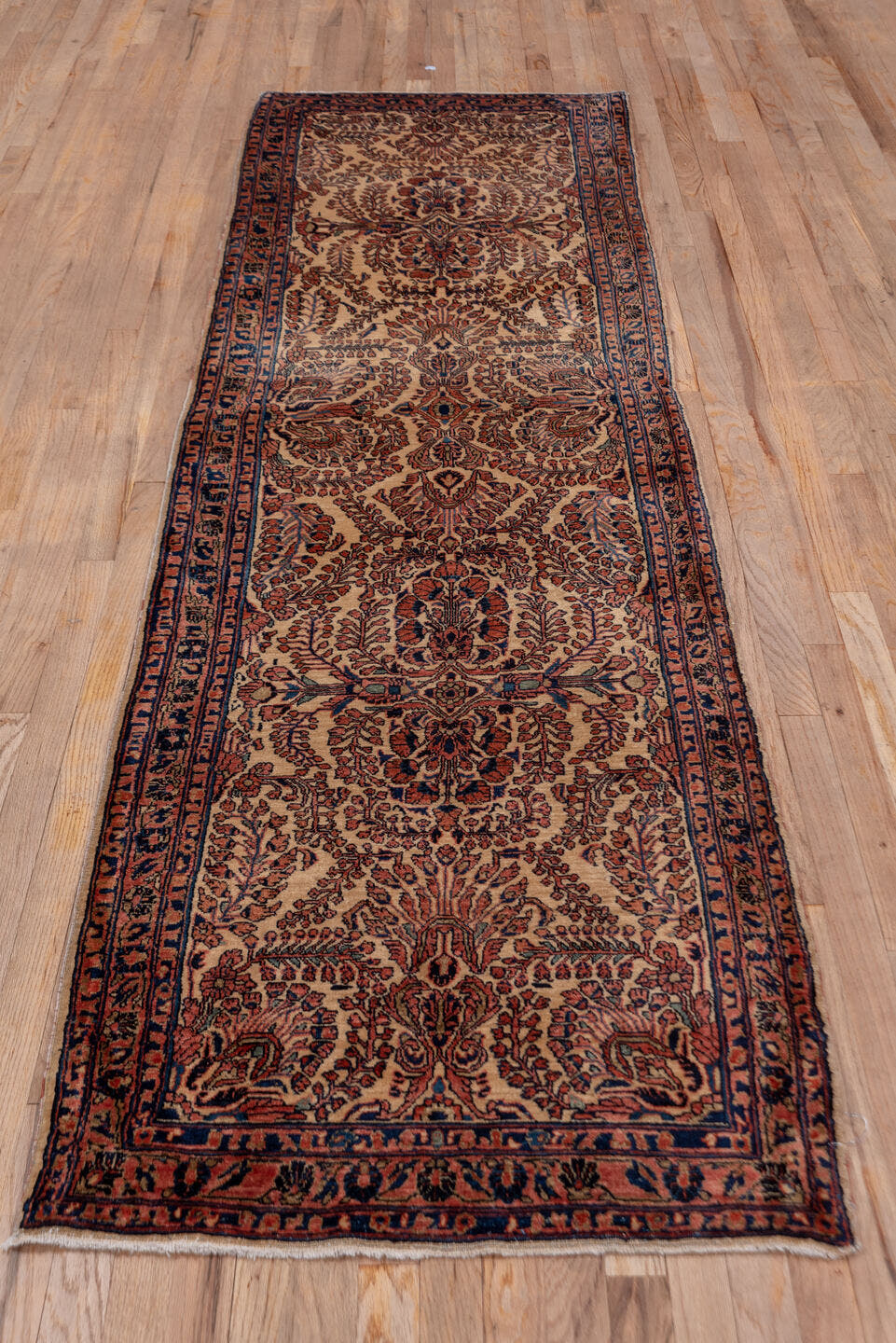 2' x 10' one-of-a-kind handmade antique Sarouk runner rug. Color palette: ivory, navy, rust, camel, burgundy, blue