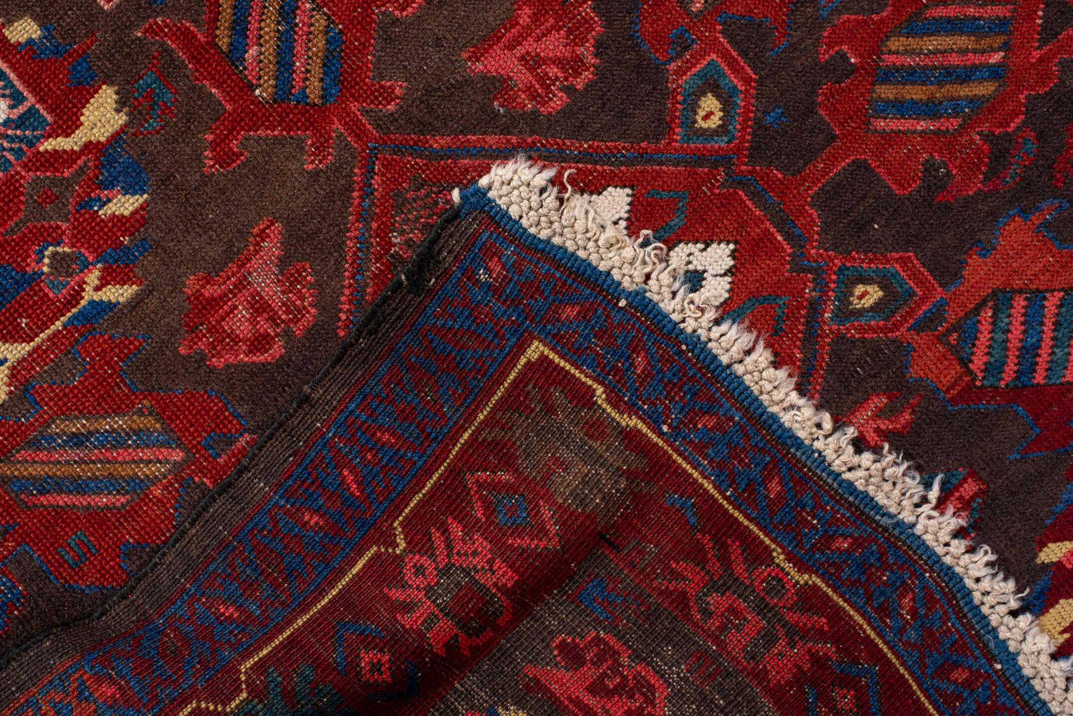 3' x 6' one-of-a-kind handmade vintage Zeichur small size rug. Color palette: brown, red, blue, crimson, ivory, pink