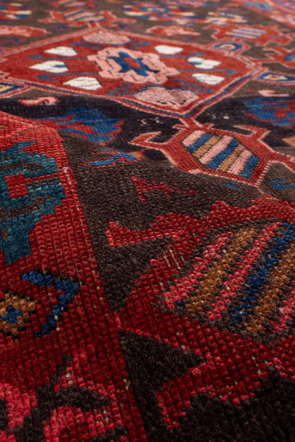 3' x 6' one-of-a-kind handmade vintage Zeichur small size rug. Color palette: brown, red, blue, crimson, ivory, pink