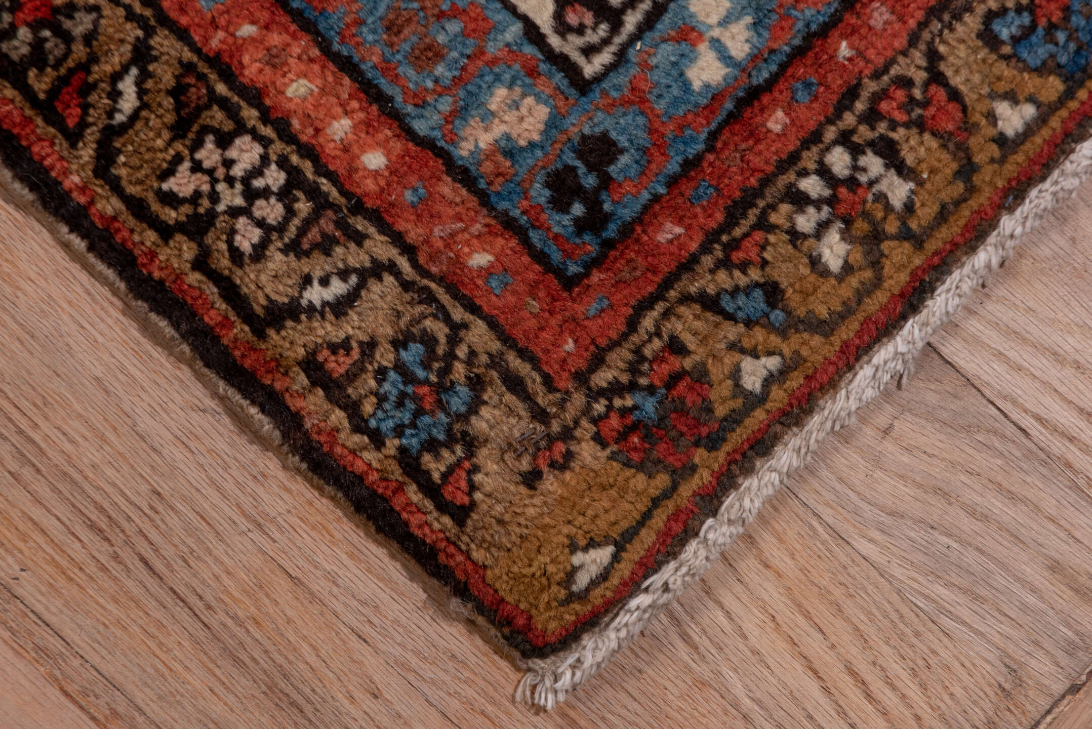 12' x 18' one-of-a-kind handmade antique Serapi oversize rug. Color palette: ivory, rust, brick red, indigo, sky blue, camel