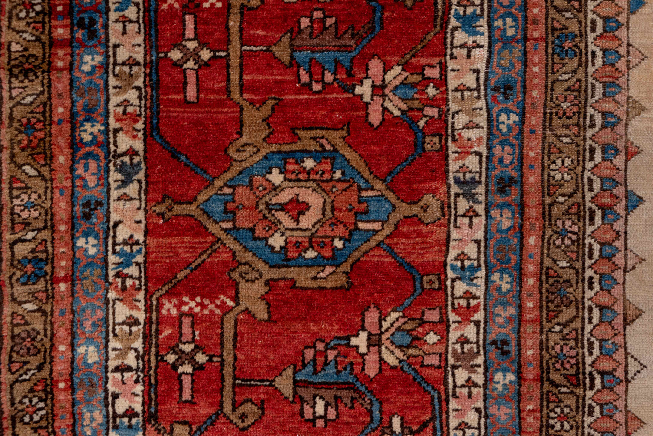 12' x 18' one-of-a-kind handmade antique Serapi oversize rug. Color palette: ivory, rust, brick red, indigo, sky blue, camel