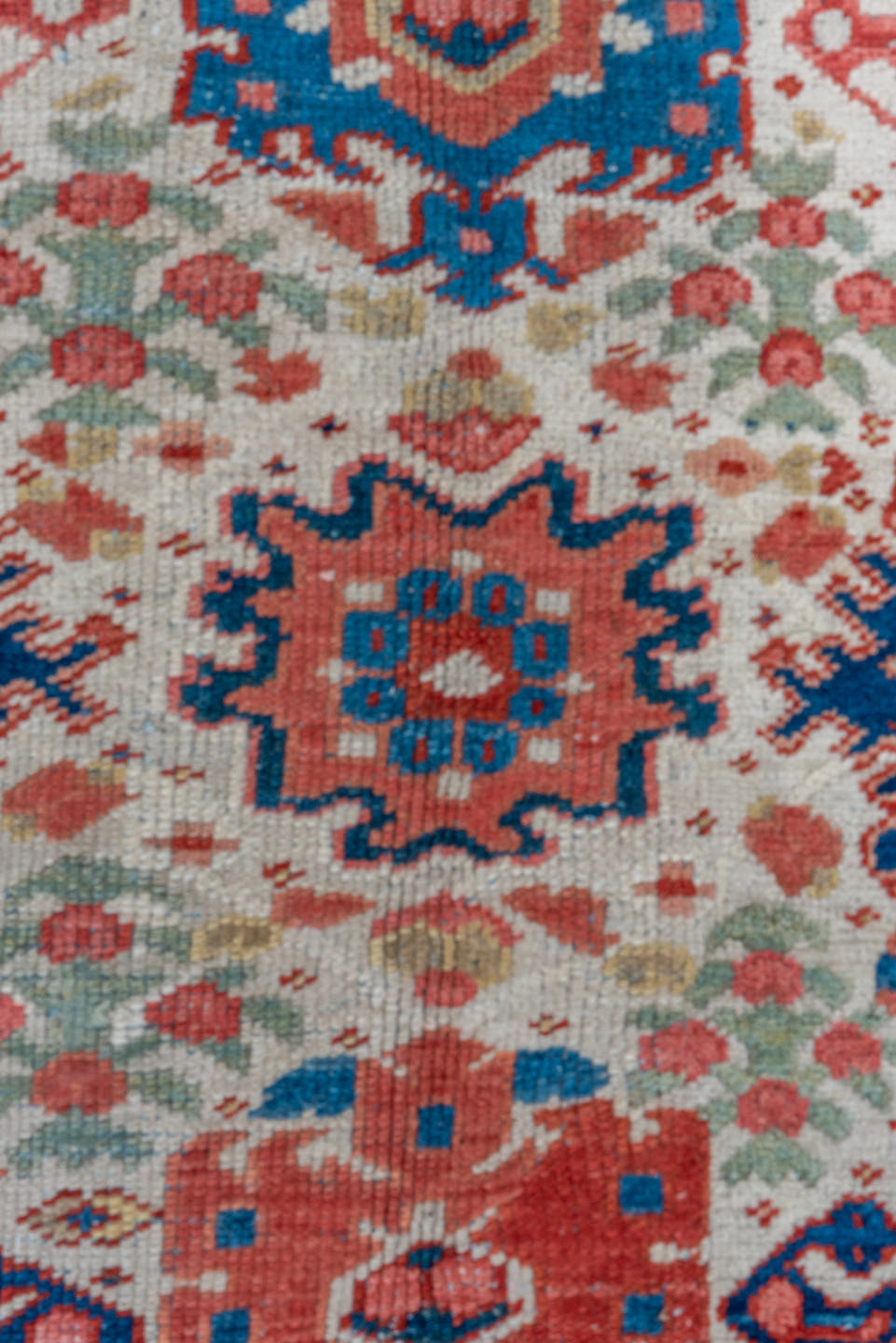 7' x 10' one-of-a-kind handmade antique Heriz large size rug. Color palette: ivory, navy, sky blue, rust, blush, crimson