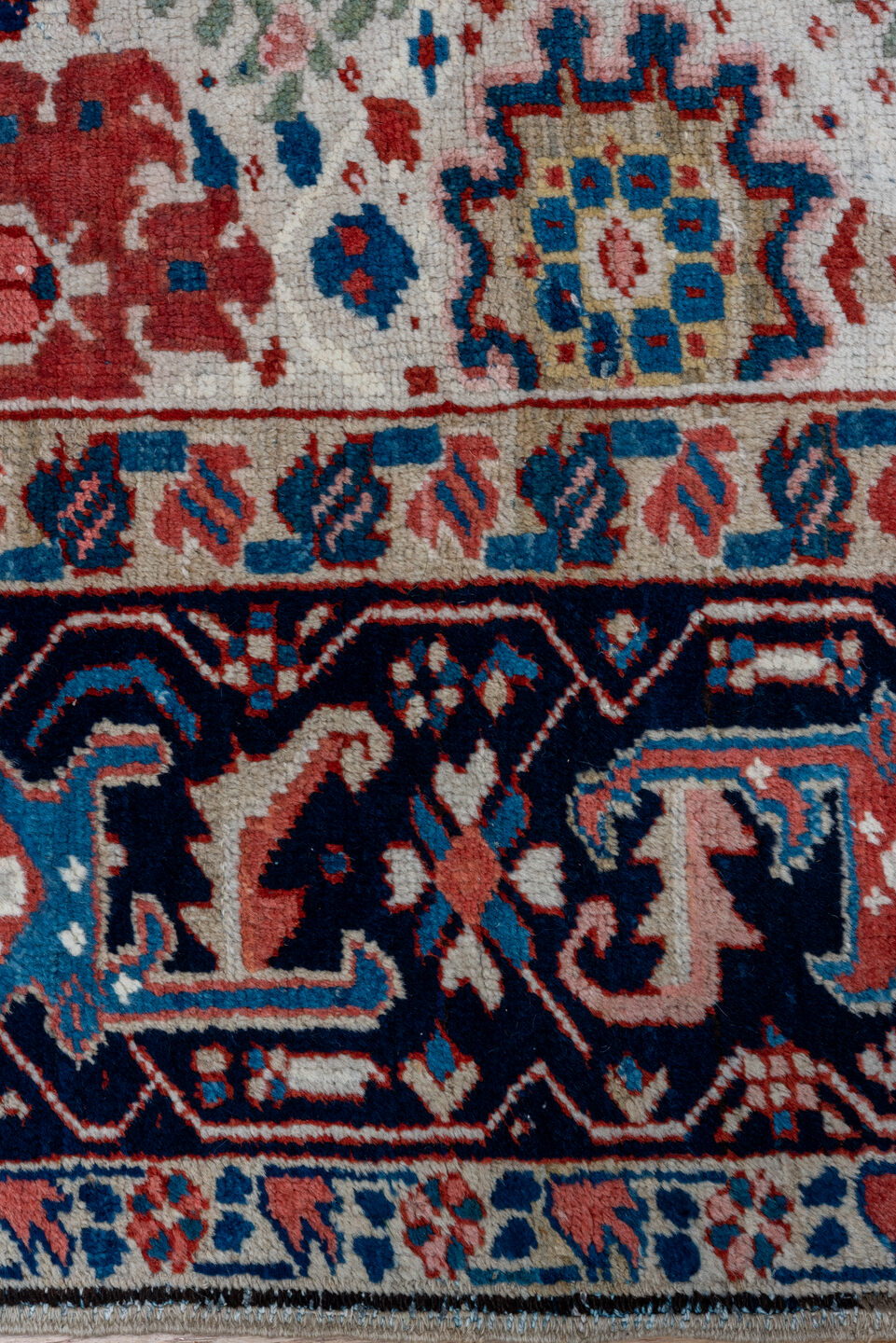 7' x 10' one-of-a-kind handmade antique Heriz large size rug. Color palette: ivory, navy, sky blue, rust, blush, crimson