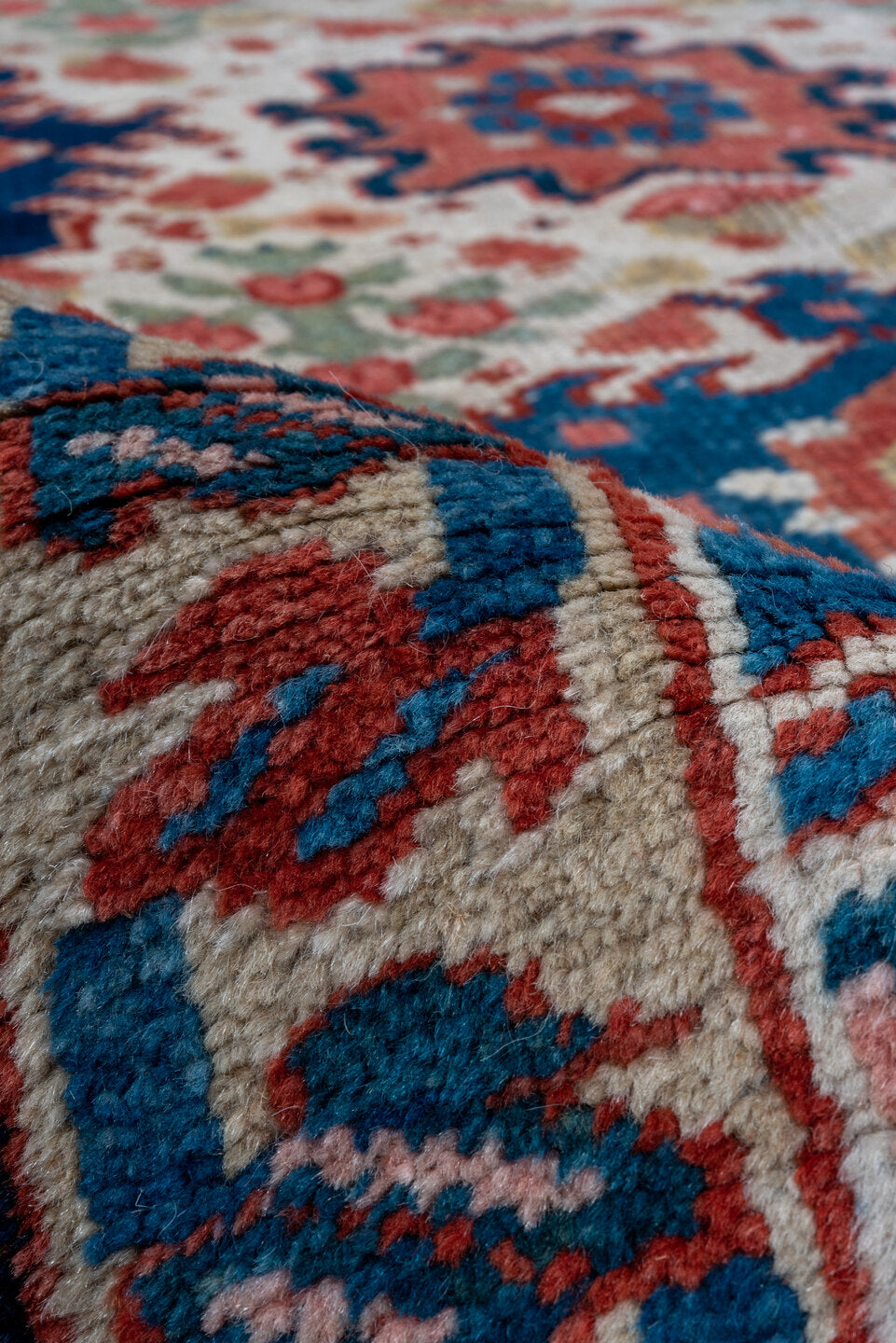 7' x 10' one-of-a-kind handmade antique Heriz large size rug. Color palette: ivory, navy, sky blue, rust, blush, crimson