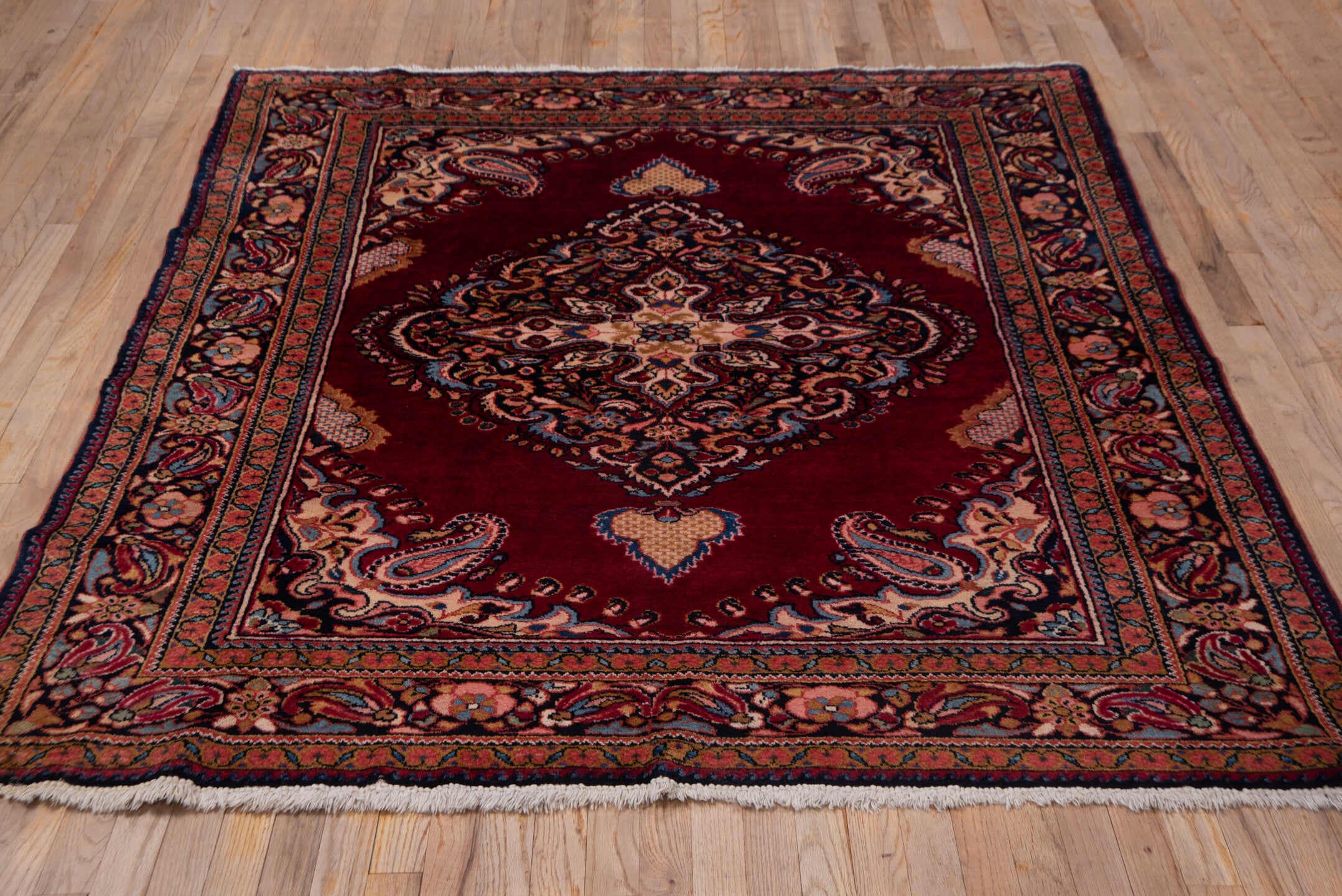 5' x 6' one-of-a-kind handmade vintage Lilian rug. Color palette: crimson, navy, ivory, rose, camel, sky_blue, burgundy, red
