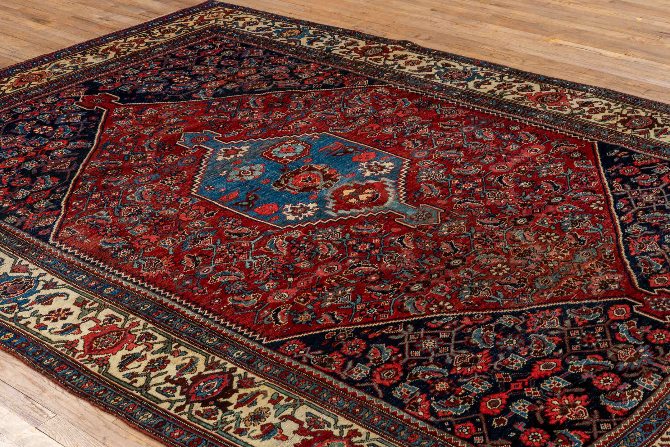7' x 10' one-of-a-kind handmade antique Bidjar large size rug. Color palette: red, navy, ivory, sky blue, rust, camel