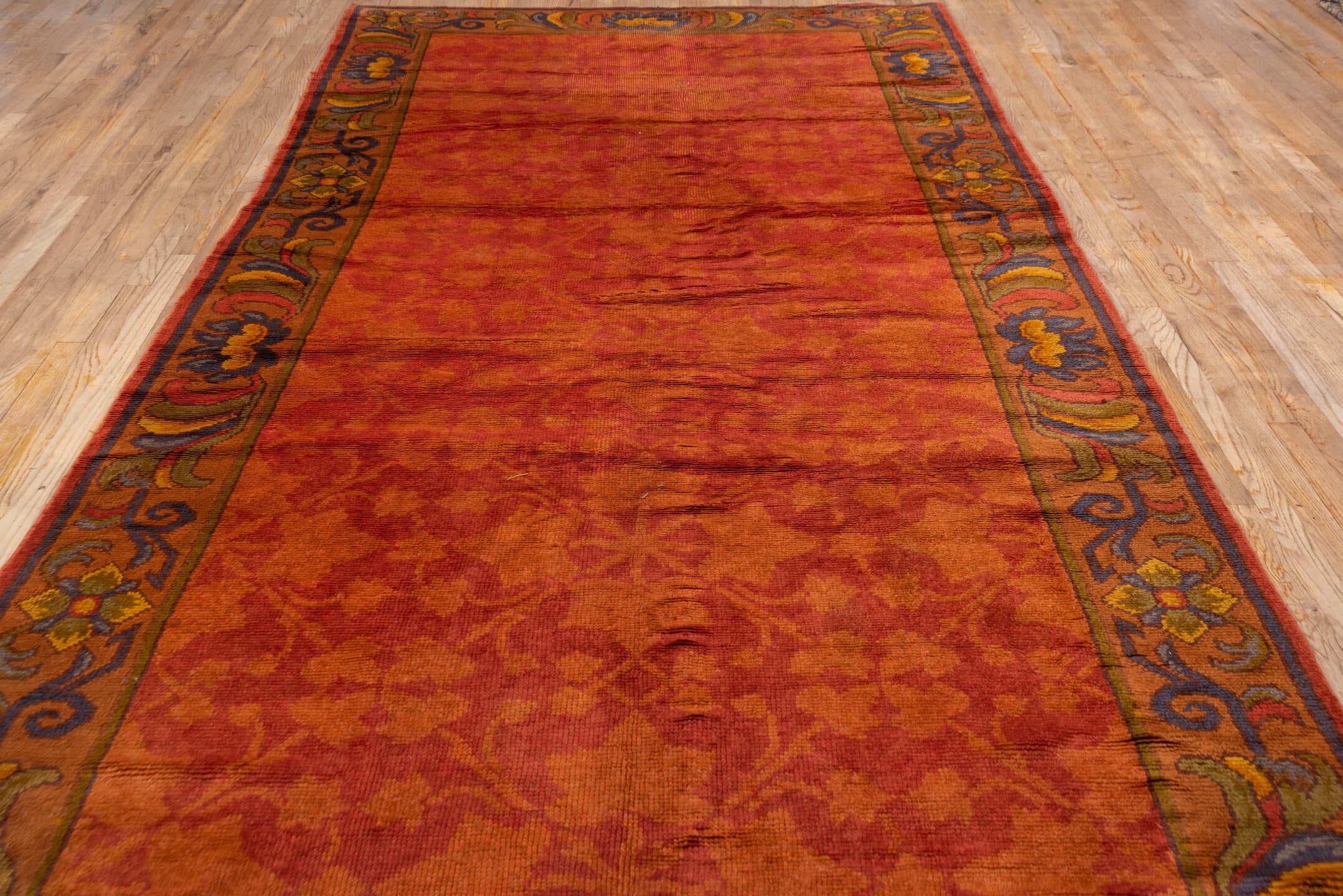 6' x 14' one-of-a-kind handmade handmade Donegal rug. Color palette: terra cotta, rust, coral, gold, slate, olive