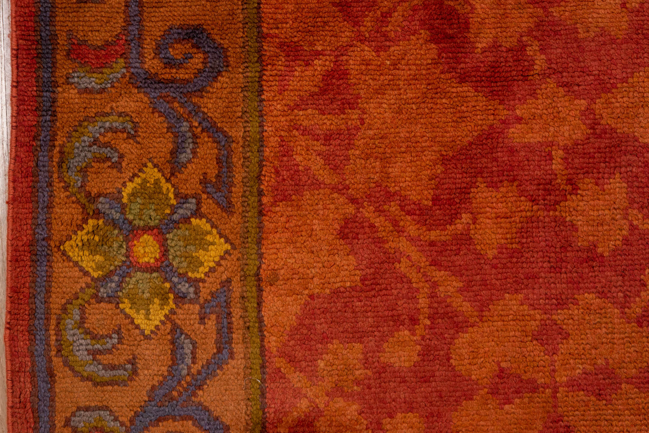 6' x 14' one-of-a-kind handmade handmade Donegal rug. Color palette: terra cotta, rust, coral, gold, slate, olive