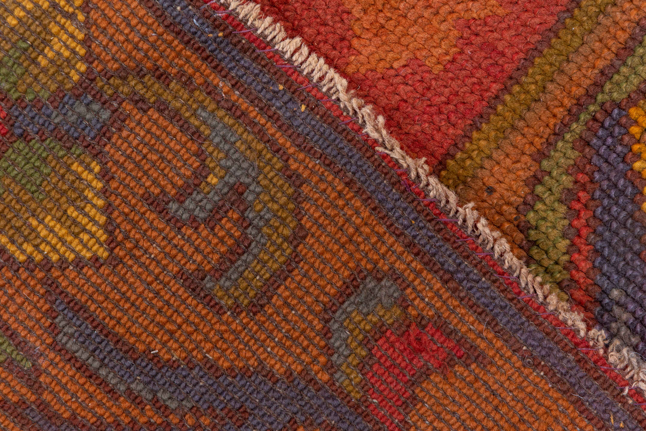 6' x 14' one-of-a-kind handmade handmade Donegal rug. Color palette: terra cotta, rust, coral, gold, slate, olive