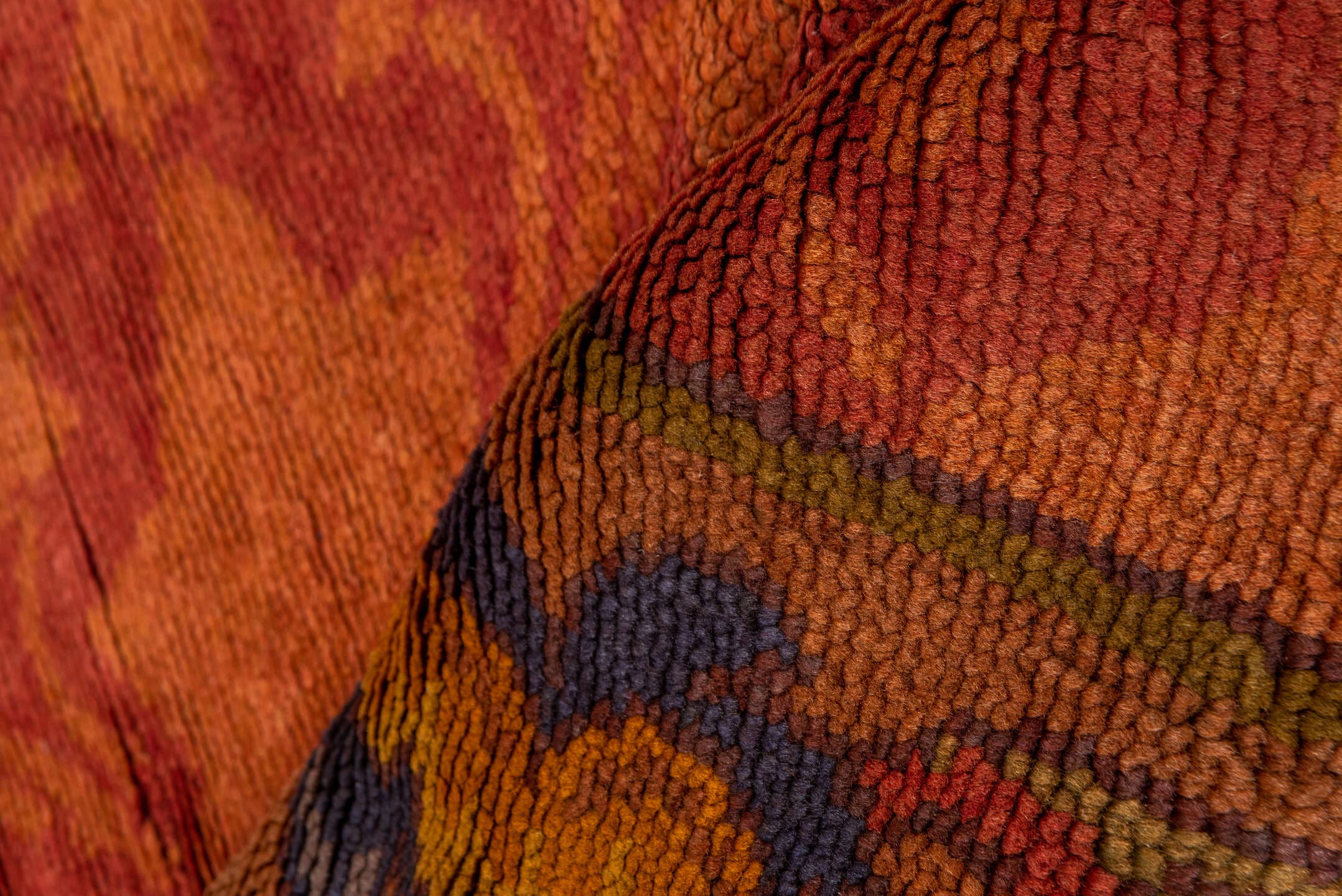 6' x 14' one-of-a-kind handmade handmade Donegal rug. Color palette: terra cotta, rust, coral, gold, slate, olive