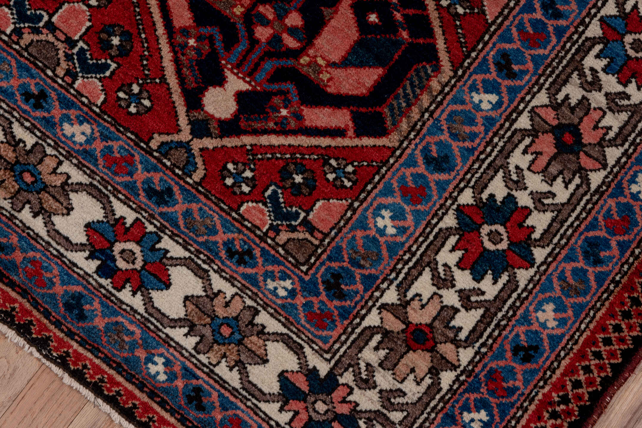5' x 7' one-of-a-kind handmade antique Baktiary rug. Color palette: rust, ivory, navy, sky_blue, rose, charcoal, slate