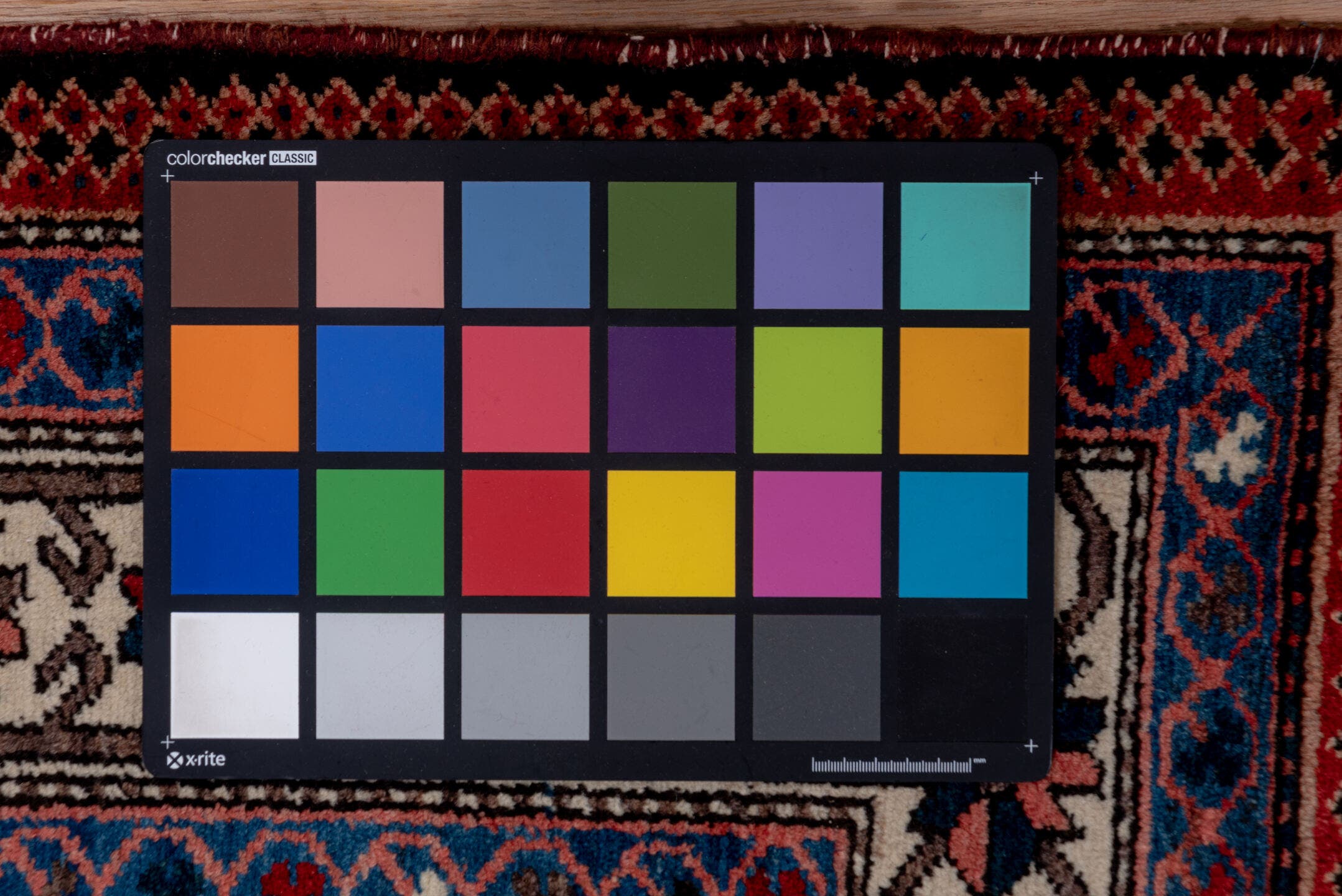 5' x 7' one-of-a-kind handmade antique Baktiary rug. Color palette: rust, ivory, navy, sky_blue, rose, charcoal, slate