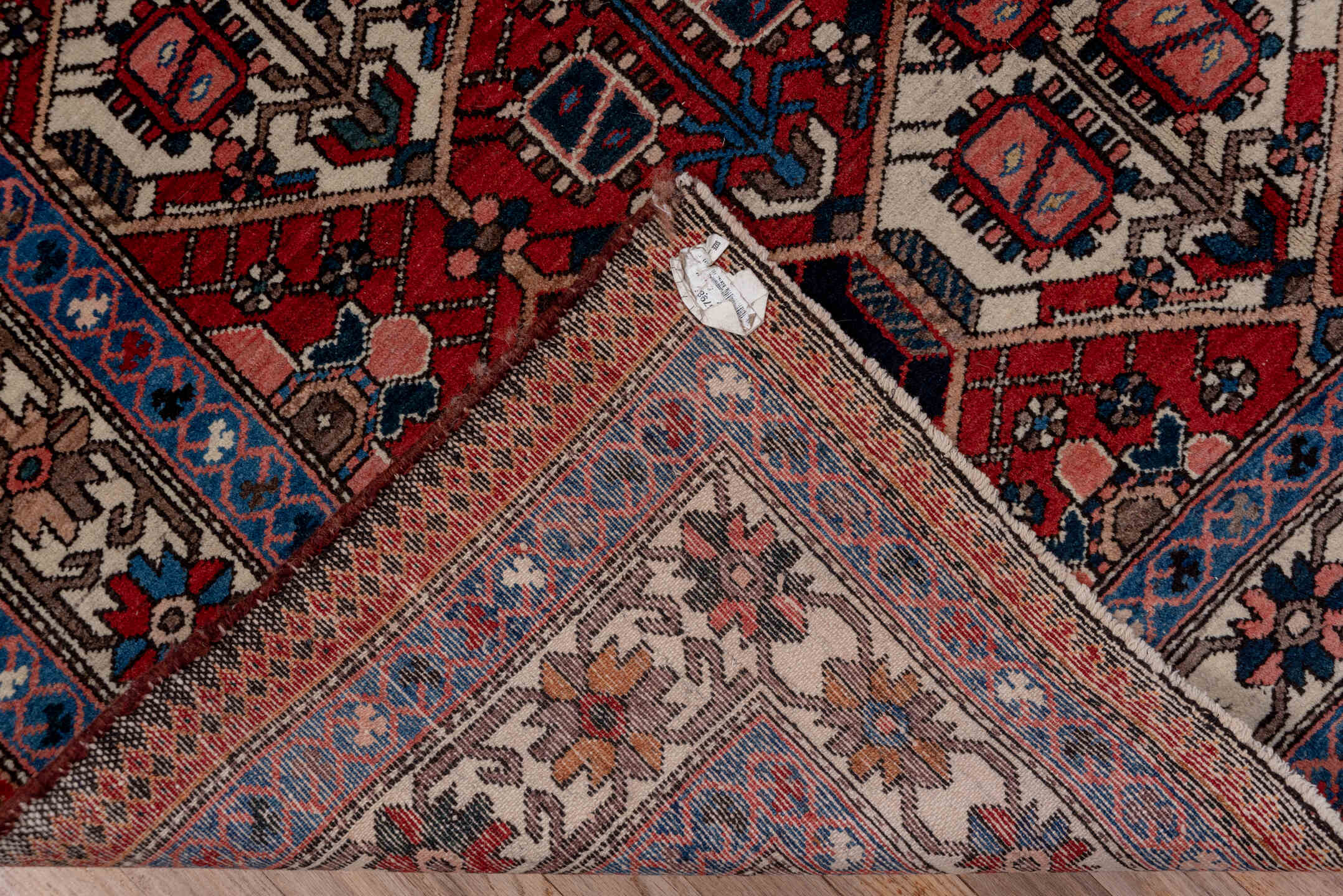 5' x 7' one-of-a-kind handmade antique Baktiary rug. Color palette: rust, ivory, navy, sky_blue, rose, charcoal, slate
