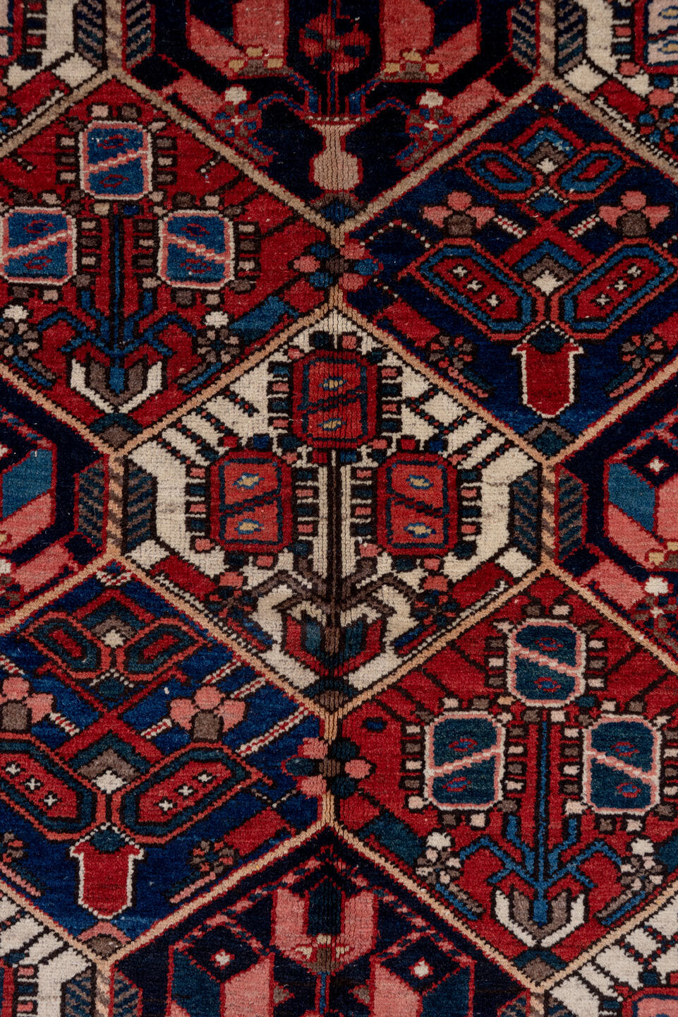 5' x 7' one-of-a-kind handmade antique Baktiary rug. Color palette: rust, ivory, navy, sky_blue, rose, charcoal, slate