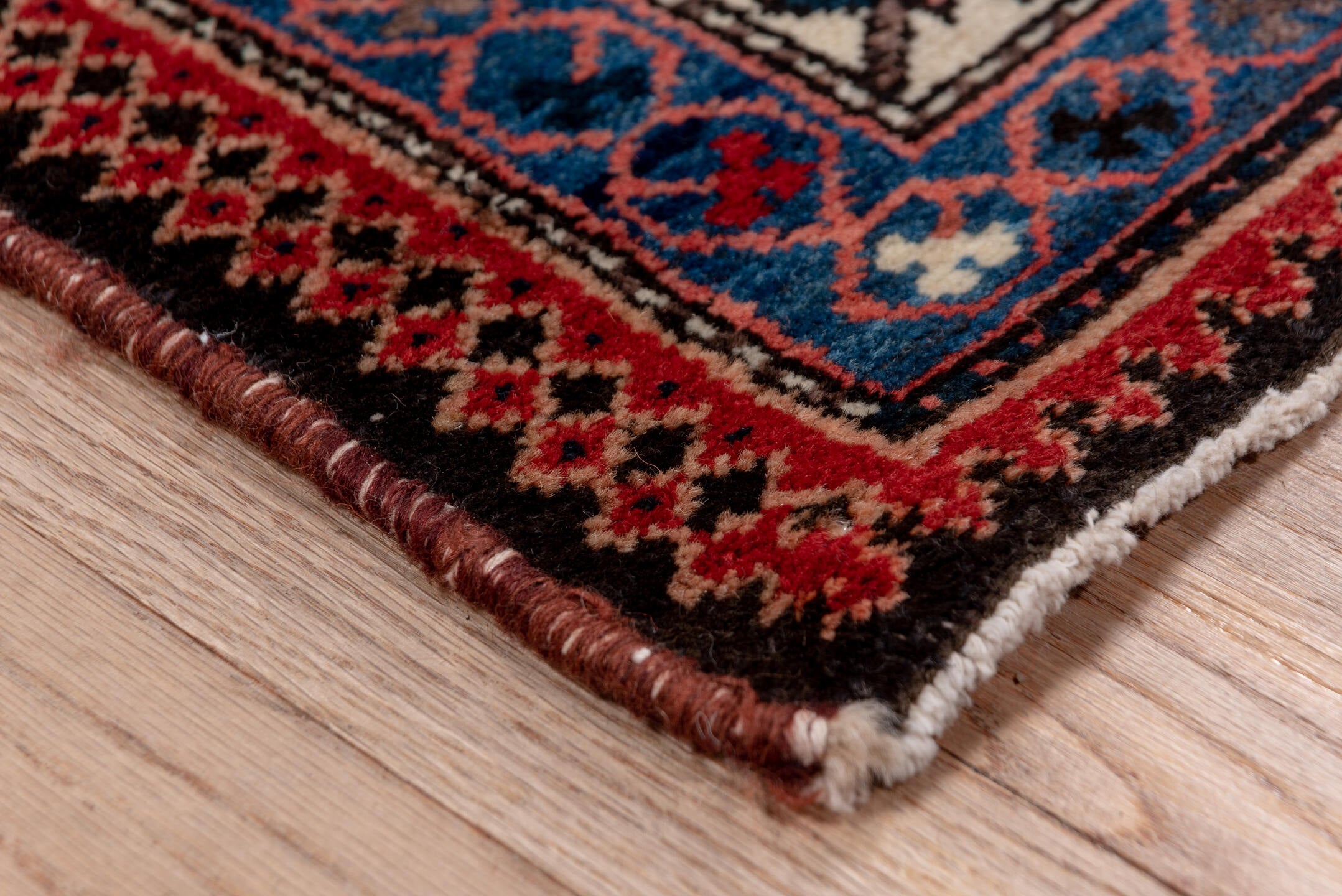 5' x 7' one-of-a-kind handmade vintage Baktiary rug. Color palette: black, blue, brown, charcoal, fiord, gray, light gray