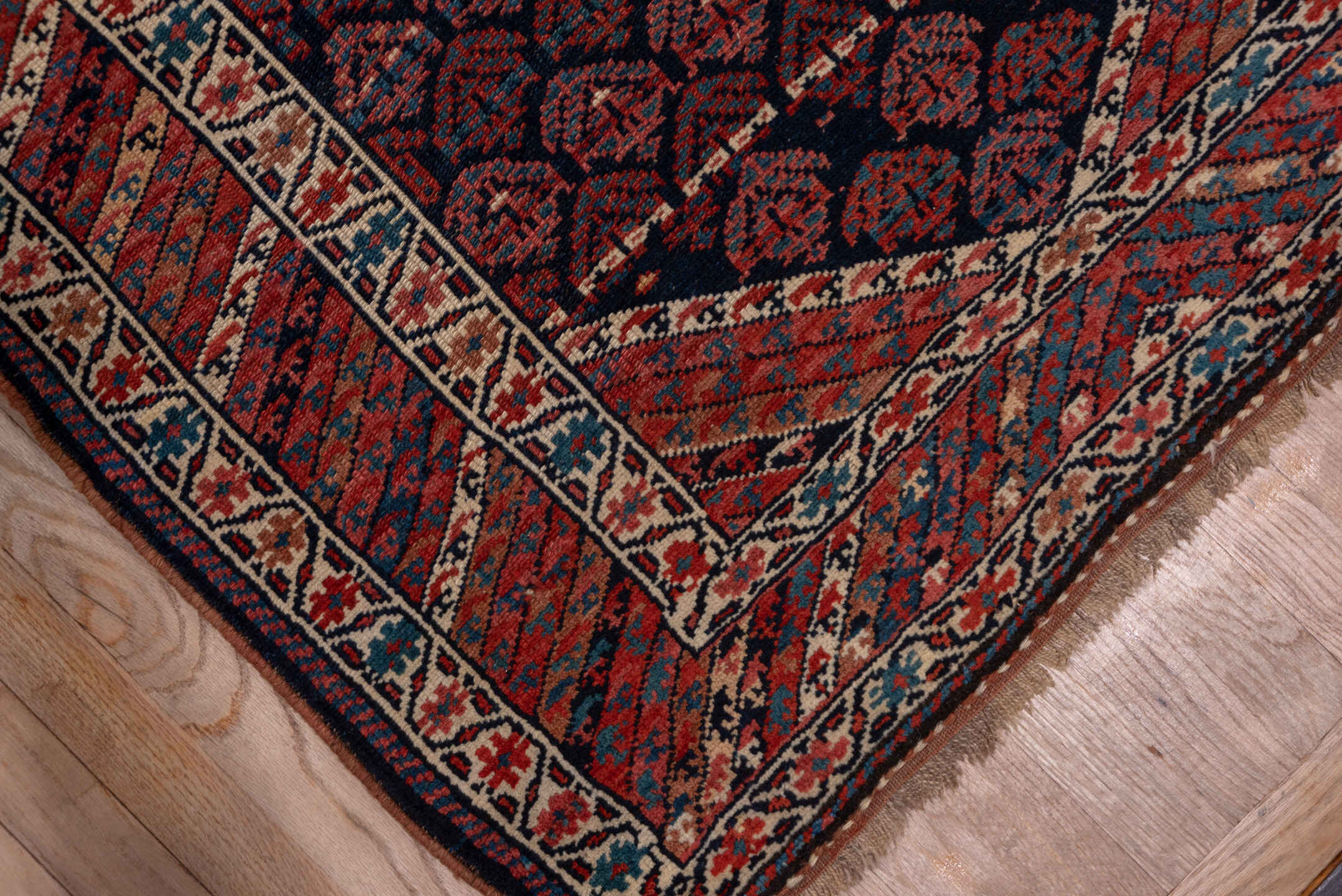 3' x 16' one-of-a-kind handmade antique Kurd runner rug. Color palette: navy, rust, ivory, brick, slate, camel, blue