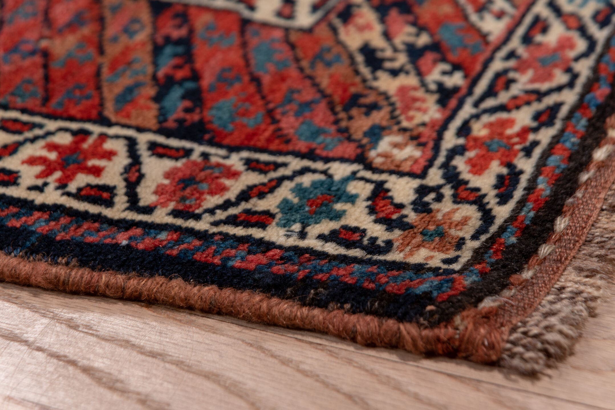 3' x 16' one-of-a-kind handmade antique Kurd runner rug. Color palette: navy, rust, ivory, brick, slate, camel, blue