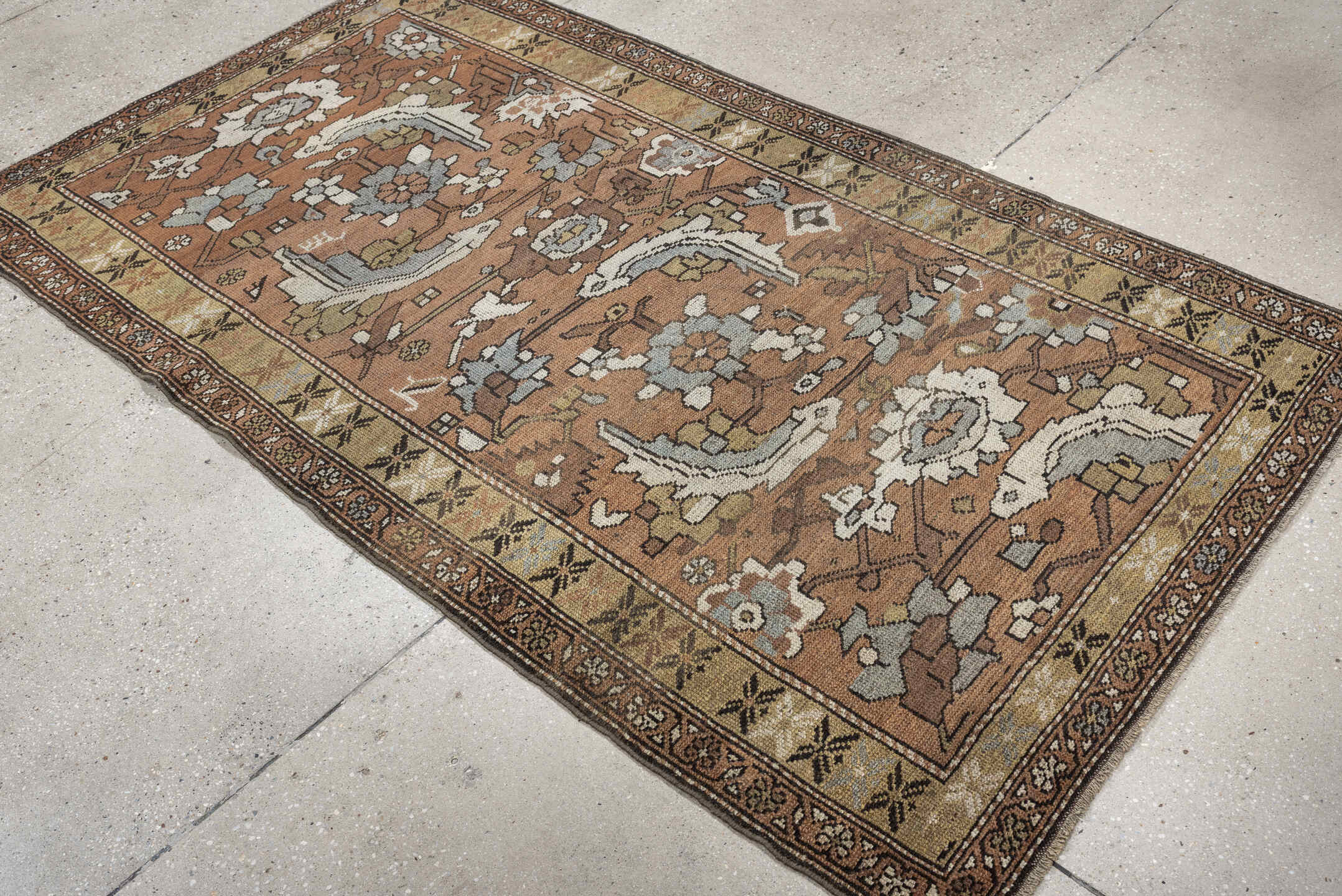 3' x 6' one-of-a-kind handmade antique Kurd rug. Color palette: terra cotta, ivory, sage, slate, camel, charcoal, taupe