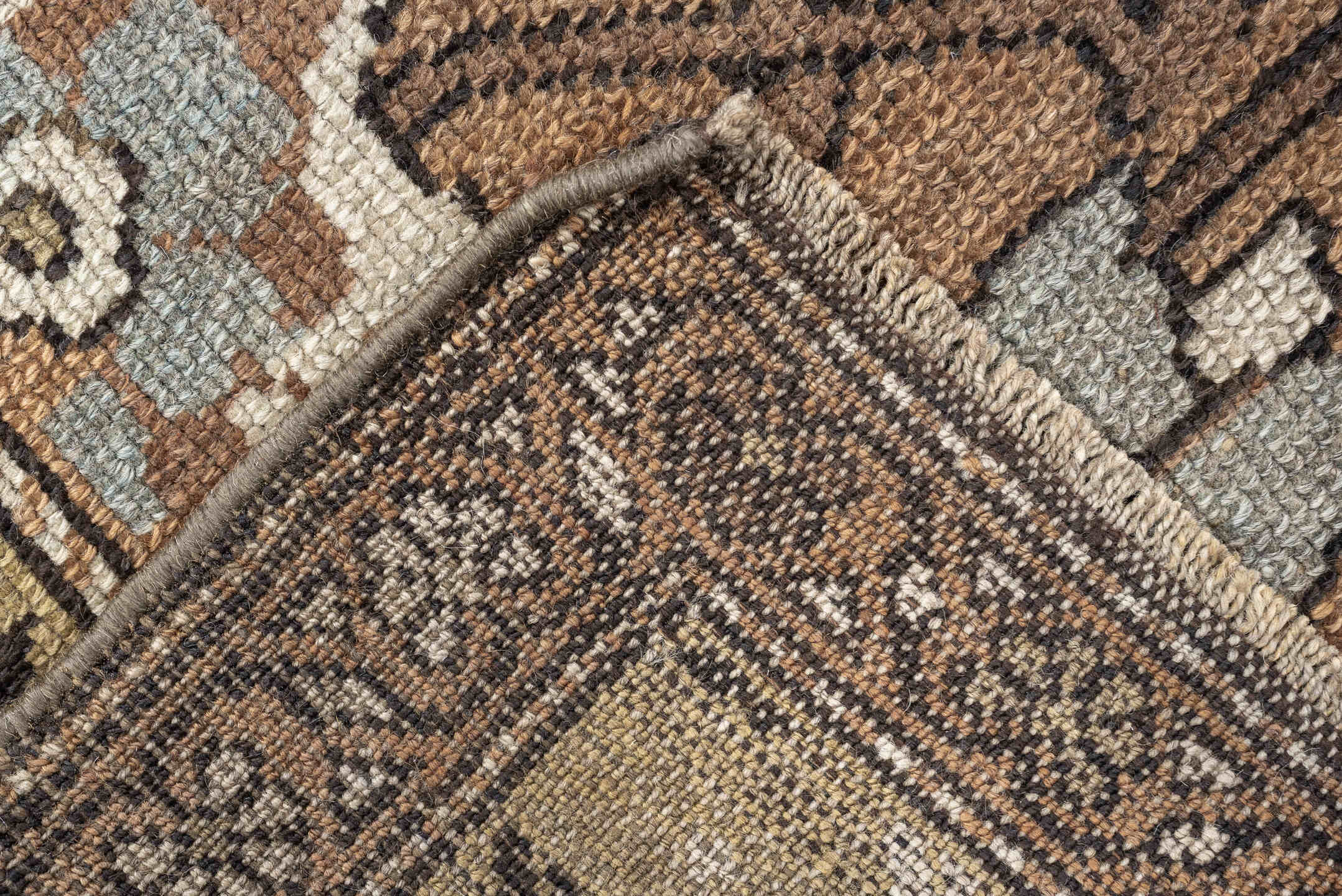 3' x 6' one-of-a-kind handmade antique Kurd rug. Color palette: terra cotta, ivory, sage, slate, camel, charcoal, taupe