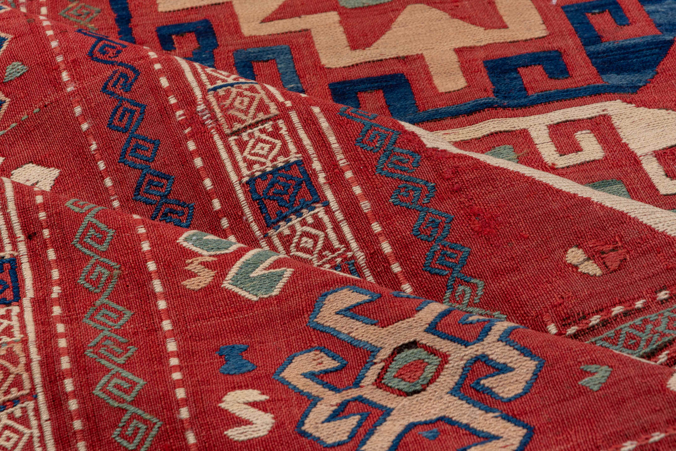 5' x 8' one-of-a-kind handmade vintage Sumak medium size rug. Color palette: blue, brown, fiord, gray, pink, red