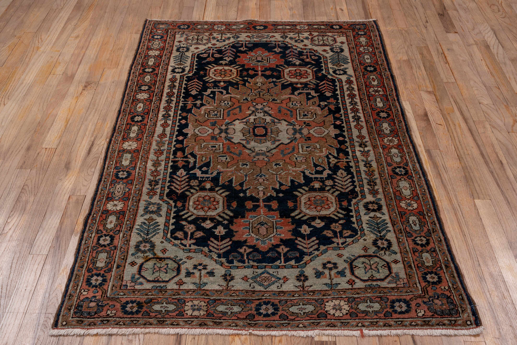 3' x 5' one-of-a-kind handmade antique Heriz small size rug. Color palette: navy, rust, ivory, taupe, slate, camel, rose