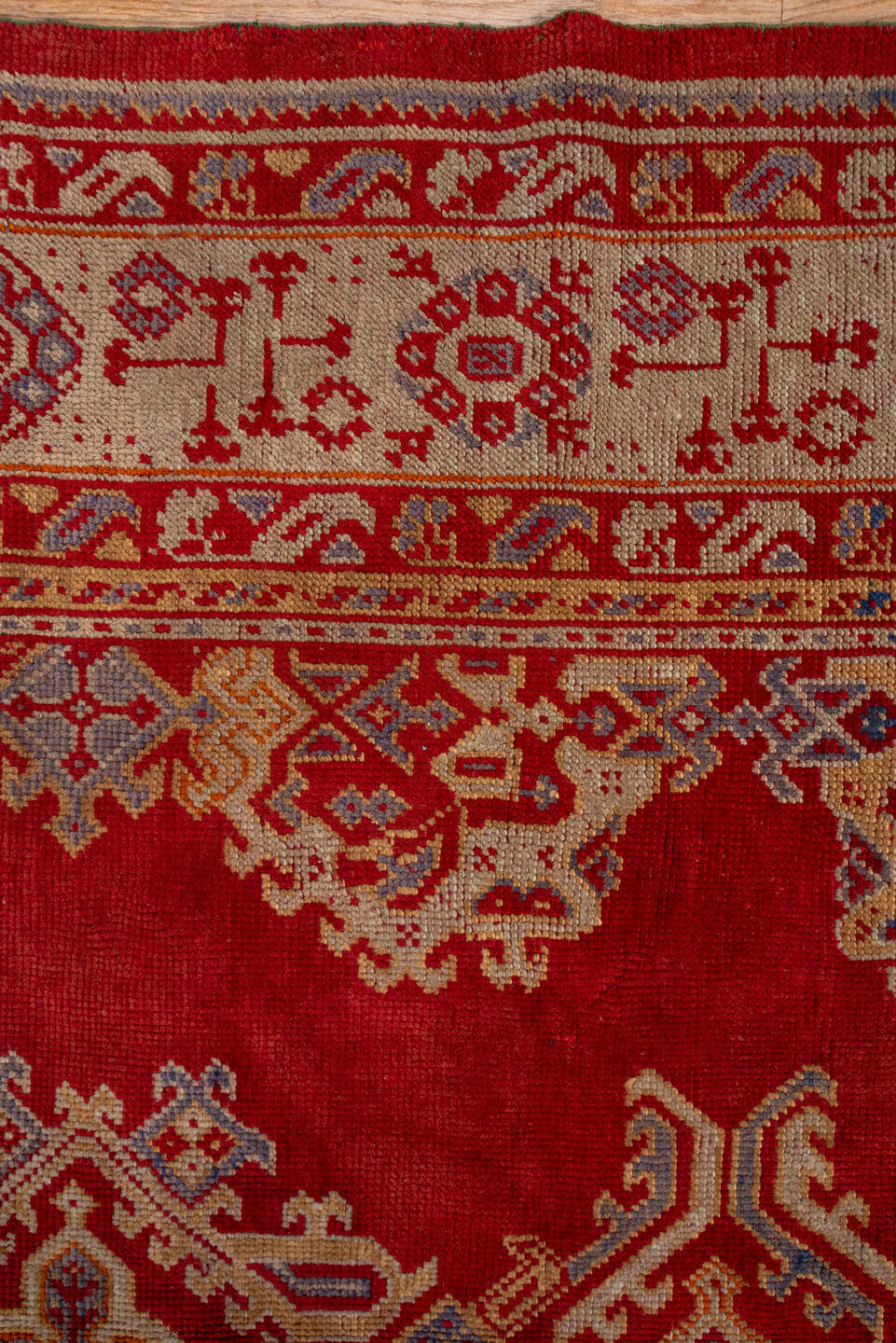 10' x 15' one-of-a-kind handmade antique Oushak rug. Color palette: rust, ivory, gold, blue, crimson, camel, terracotta