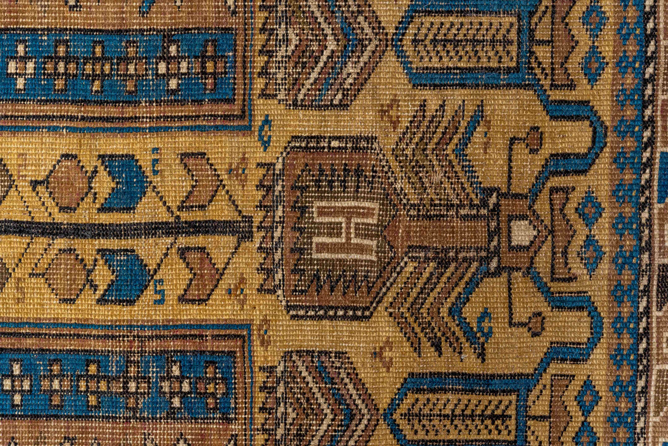 4' x 5' one-of-a-kind handmade antique Cabistan small size rug. Color palette: camel, brown, navy, ivory, taupe, charcoal
