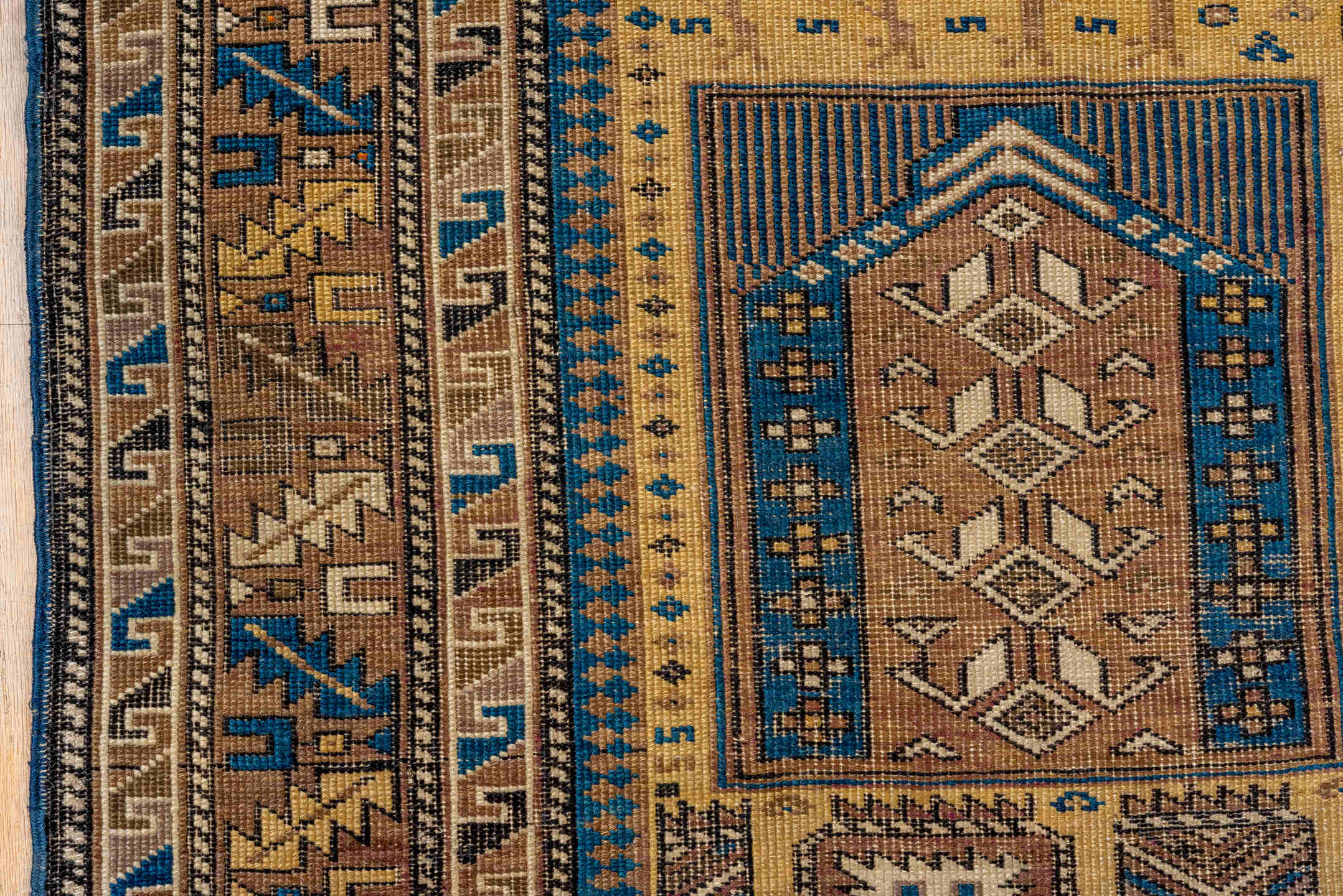 4' x 5' one-of-a-kind handmade antique Cabistan small size rug. Color palette: camel, brown, navy, ivory, taupe, charcoal