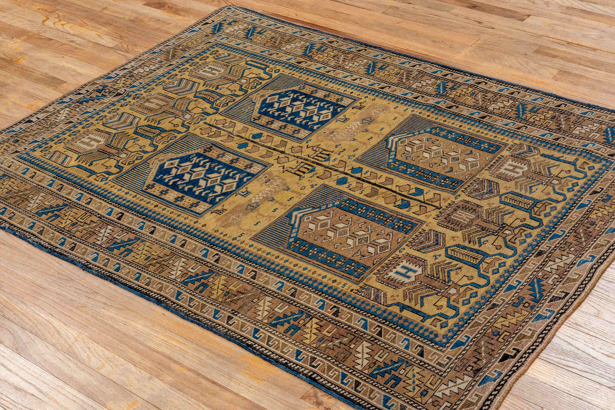 4' x 5' one-of-a-kind handmade antique Cabistan small size rug. Color palette: camel, brown, navy, ivory, taupe, charcoal