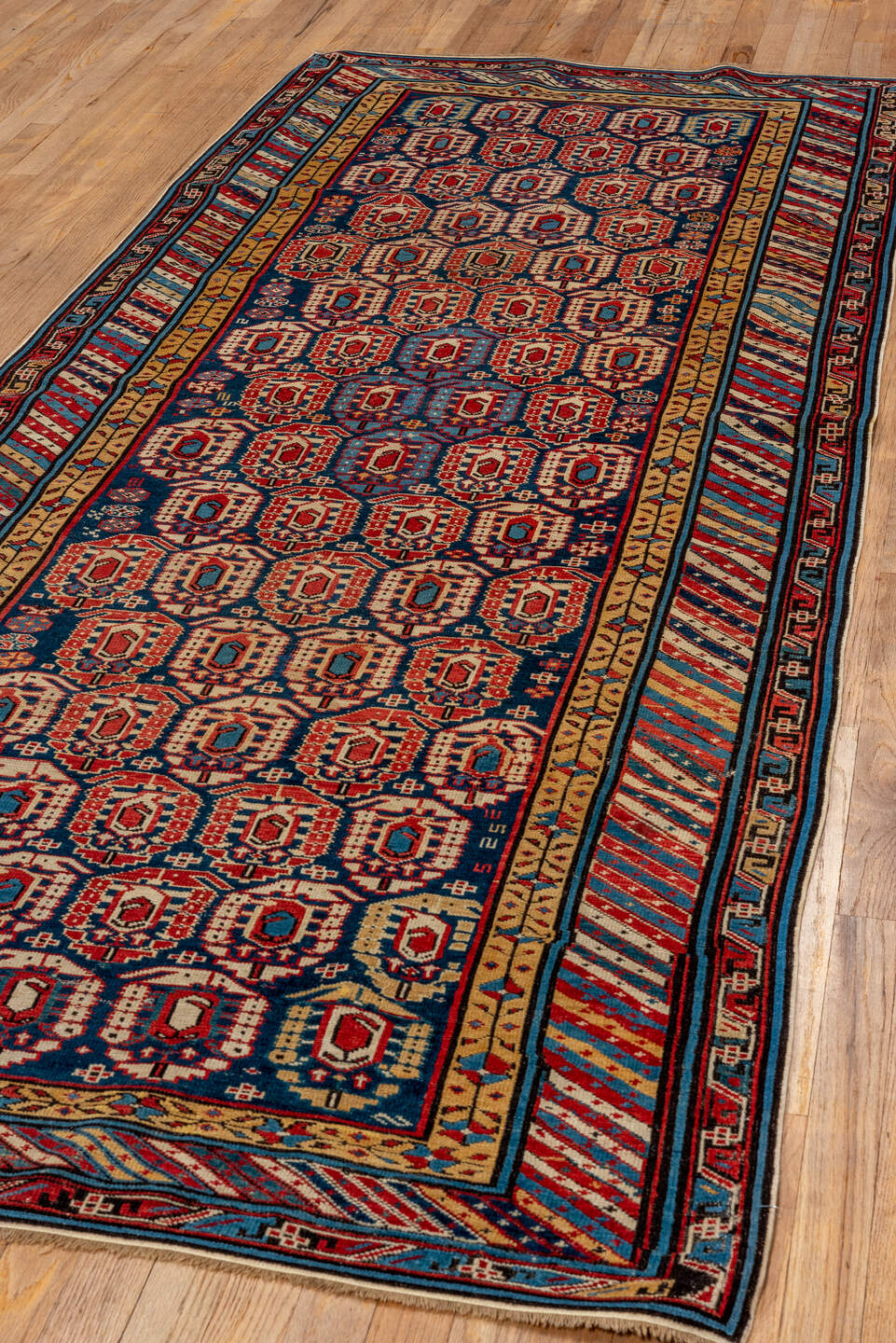 3' x 9' one-of-a-kind handmade antique Kuba runner rug. Color palette: indigo, ivory, rust, sky blue, camel, crimson, navy