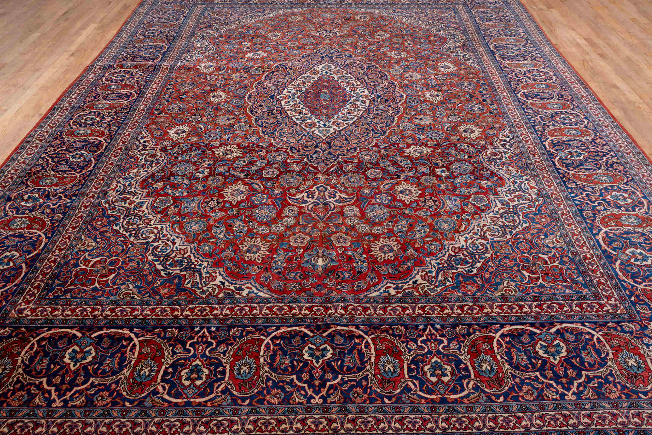 10' x 13' one-of-a-kind handmade antique Isfahan large size rug. Color palette: navy, rust, ivory, crimson, cobalt, camel