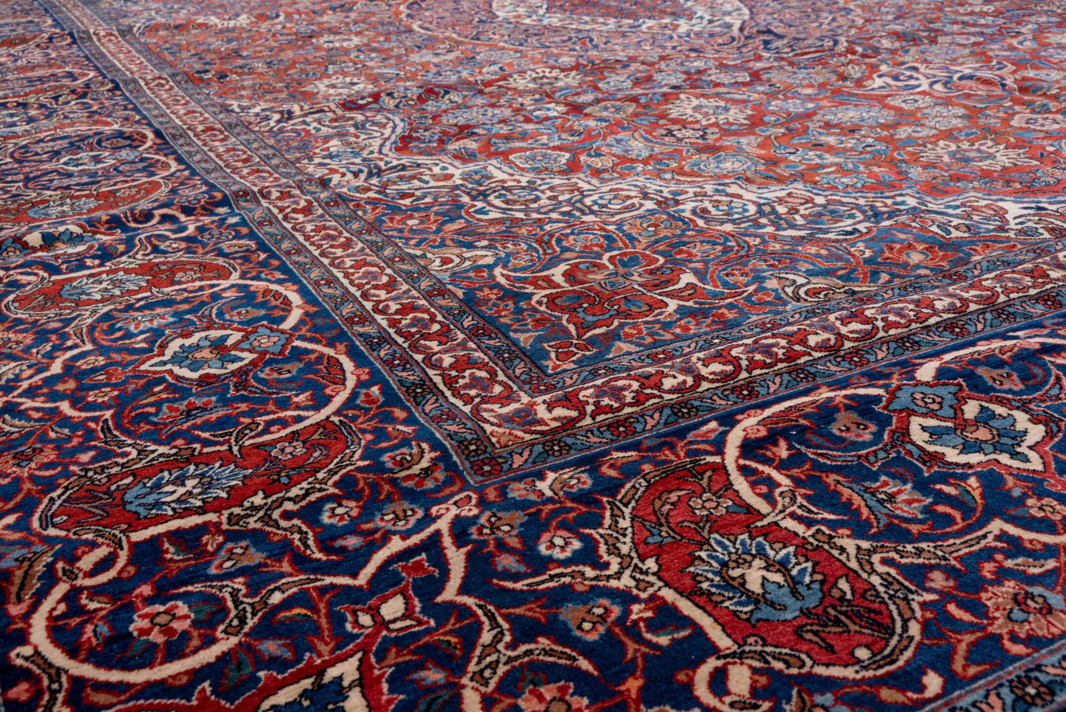 10' x 13' one-of-a-kind handmade antique Isfahan large size rug. Color palette: navy, rust, ivory, crimson, cobalt, camel