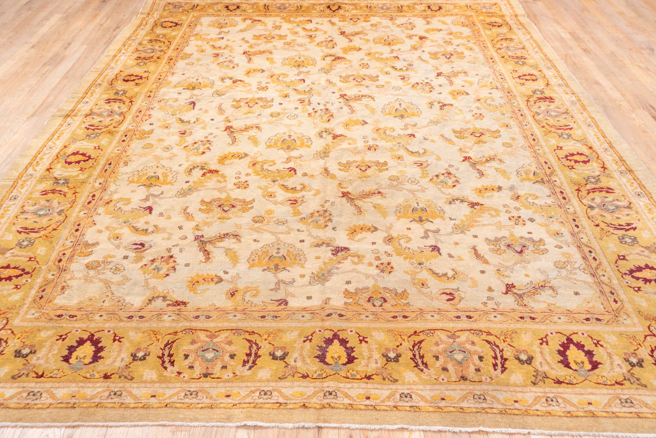 9' x 11' one-of-a-kind handmade antique Amritzar large size rug. Color palette: ivory, gold, camel, saffron, taupe, burgundy