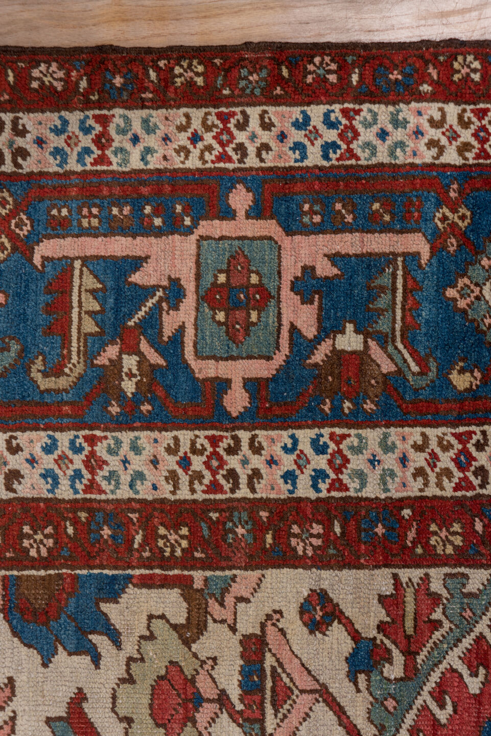 10' x 14' one-of-a-kind handmade antique Serapi large size rug. Color palette: rust, ivory, indigo, sky blue, rose, taupe