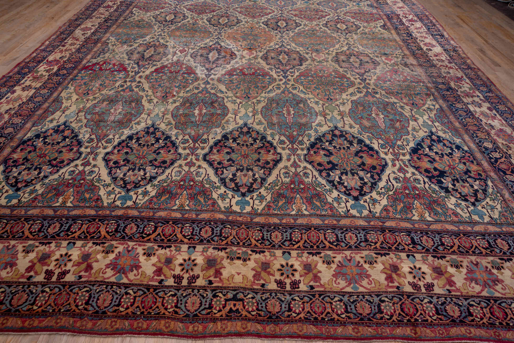 13' x 18' one-of-a-kind handmade antique Lavar oversize rug. Color palette: ivory, indigo, rust, rose, muted blue, burgundy