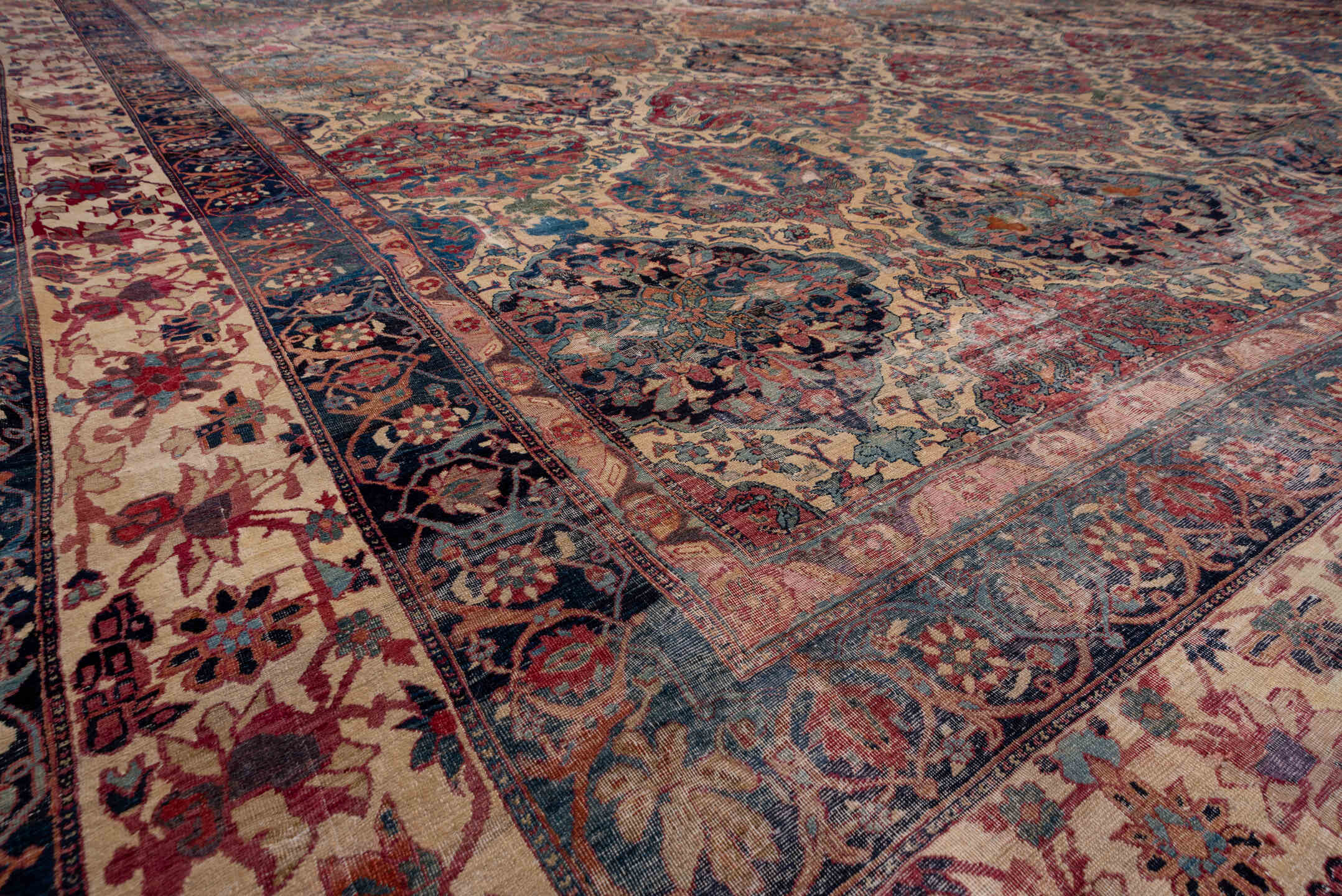 13' x 18' one-of-a-kind handmade antique Lavar oversize rug. Color palette: ivory, indigo, rust, rose, muted blue, burgundy