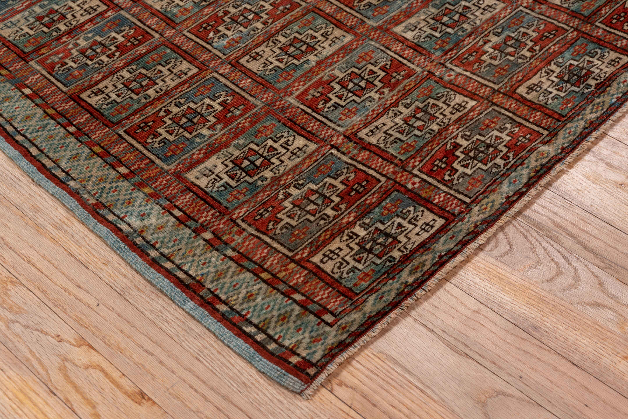 3' x 11' one-of-a-kind handmade vintage Bokara runner rug. Color palette: rust, ivory, blue gray, charcoal, taupe, burgundy