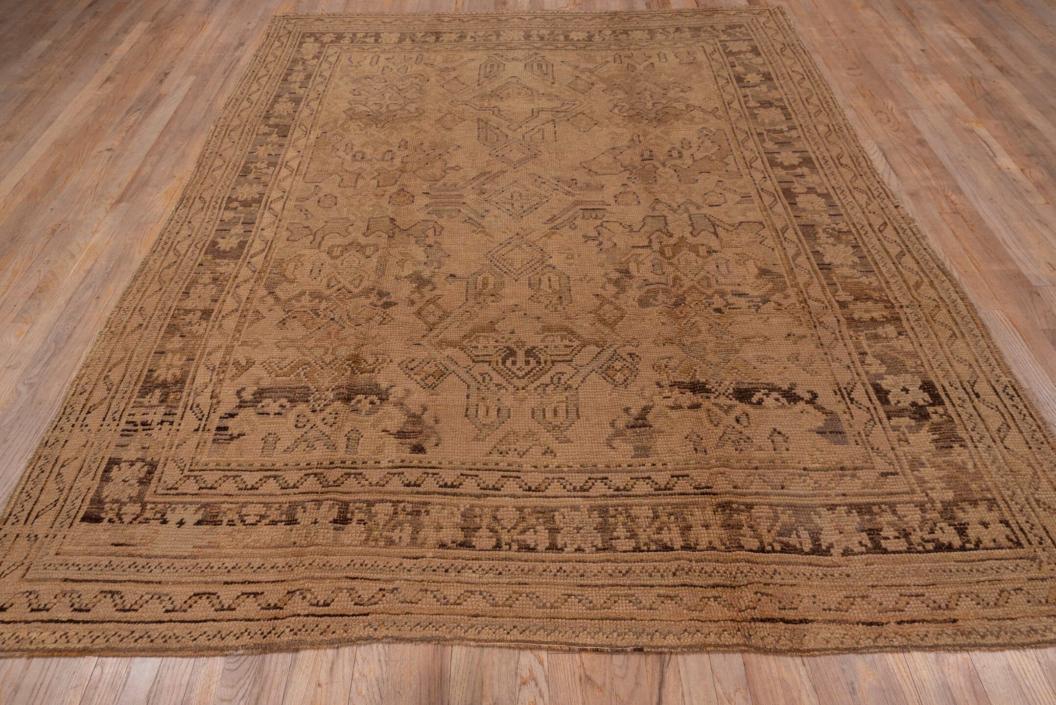 7' x 10' one-of-a-kind handmade antique Oushak large size rug. Color palette: taupe, camel, beige, brown, sand, gray