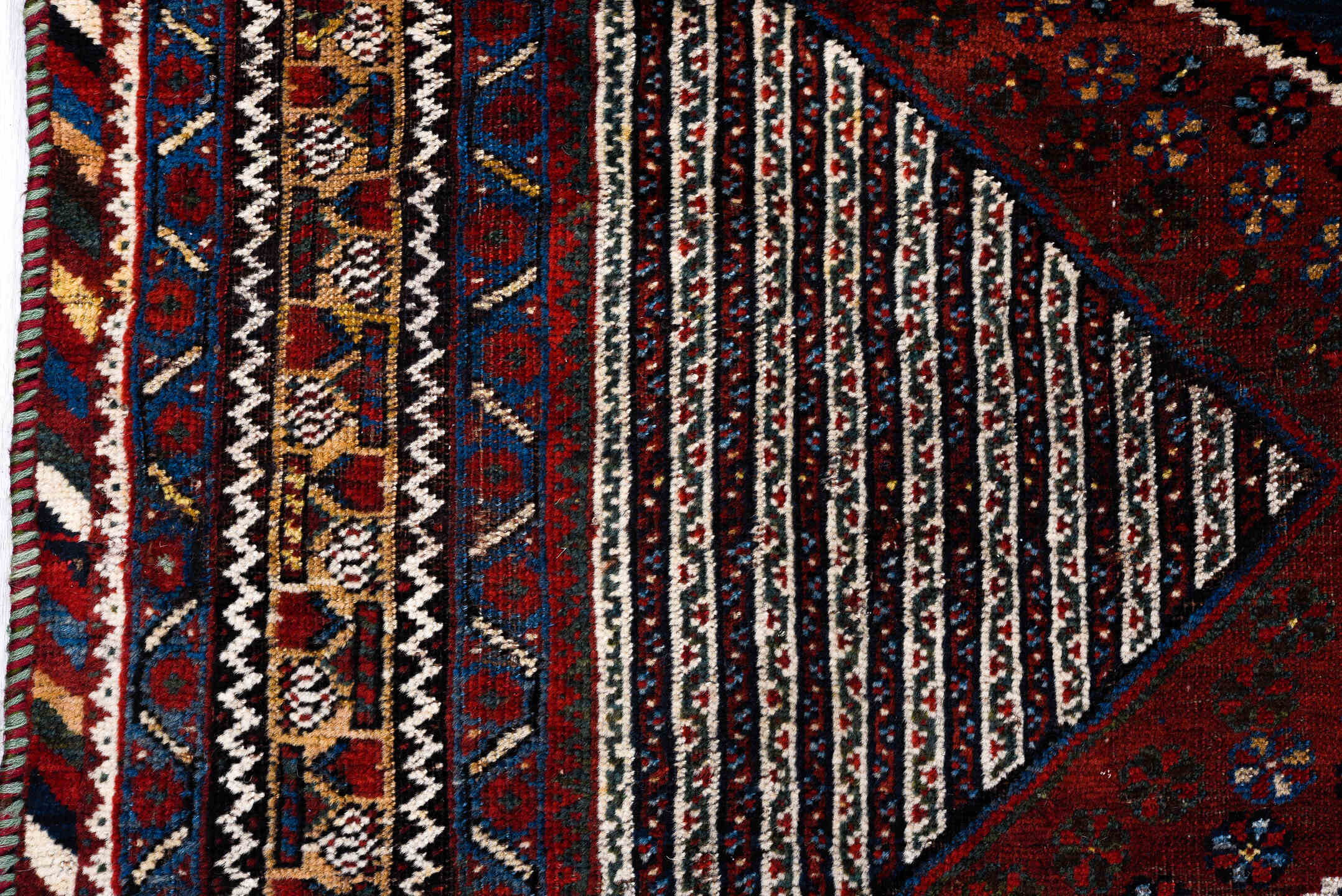 5' x 8' one-of-a-kind handmade antique Qashqai medium size rug. Color palette: rust, indigo, ivory, gold, navy, brown